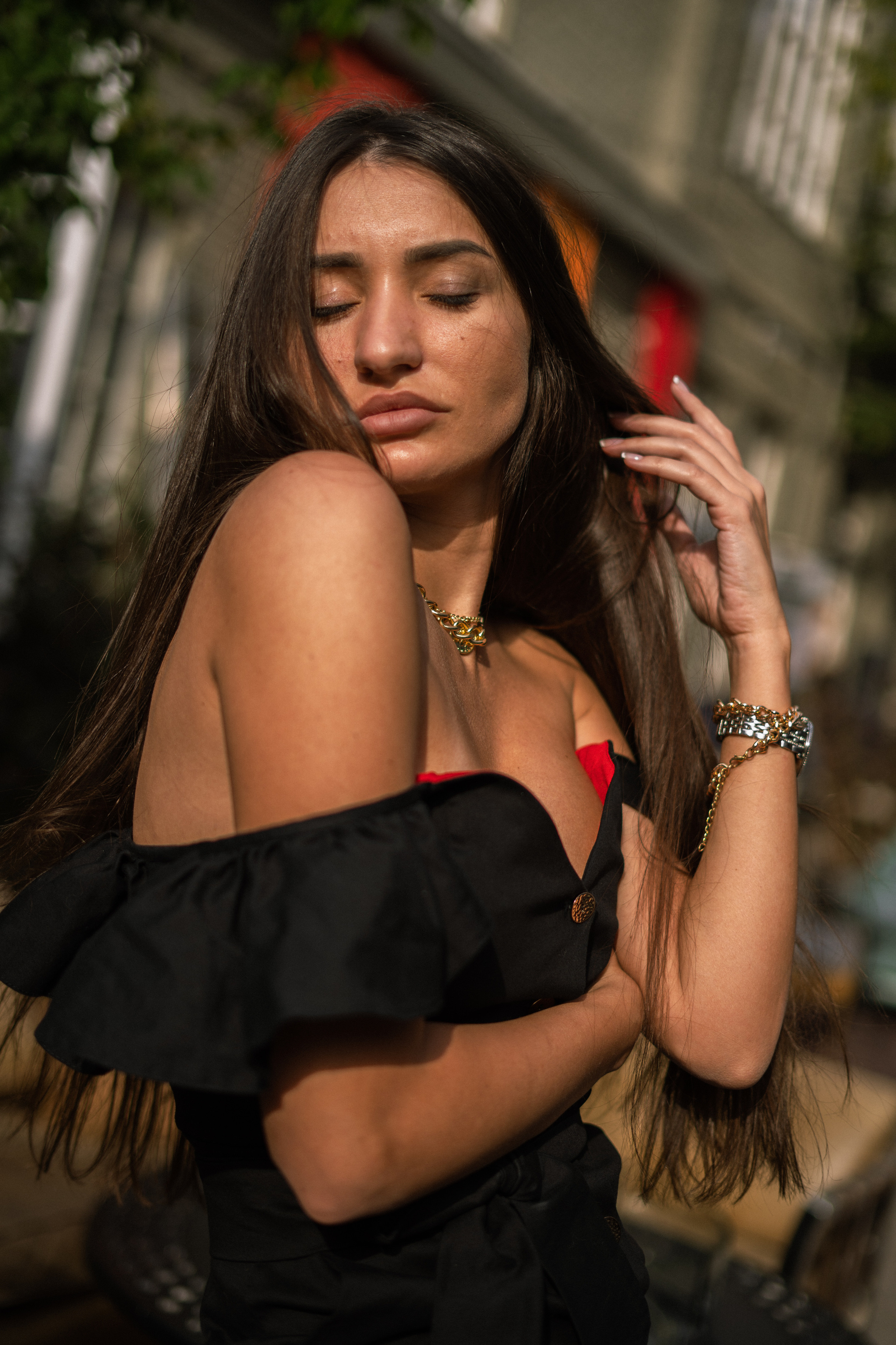 a girl in a black dress in front of ancient architecture in Moscow