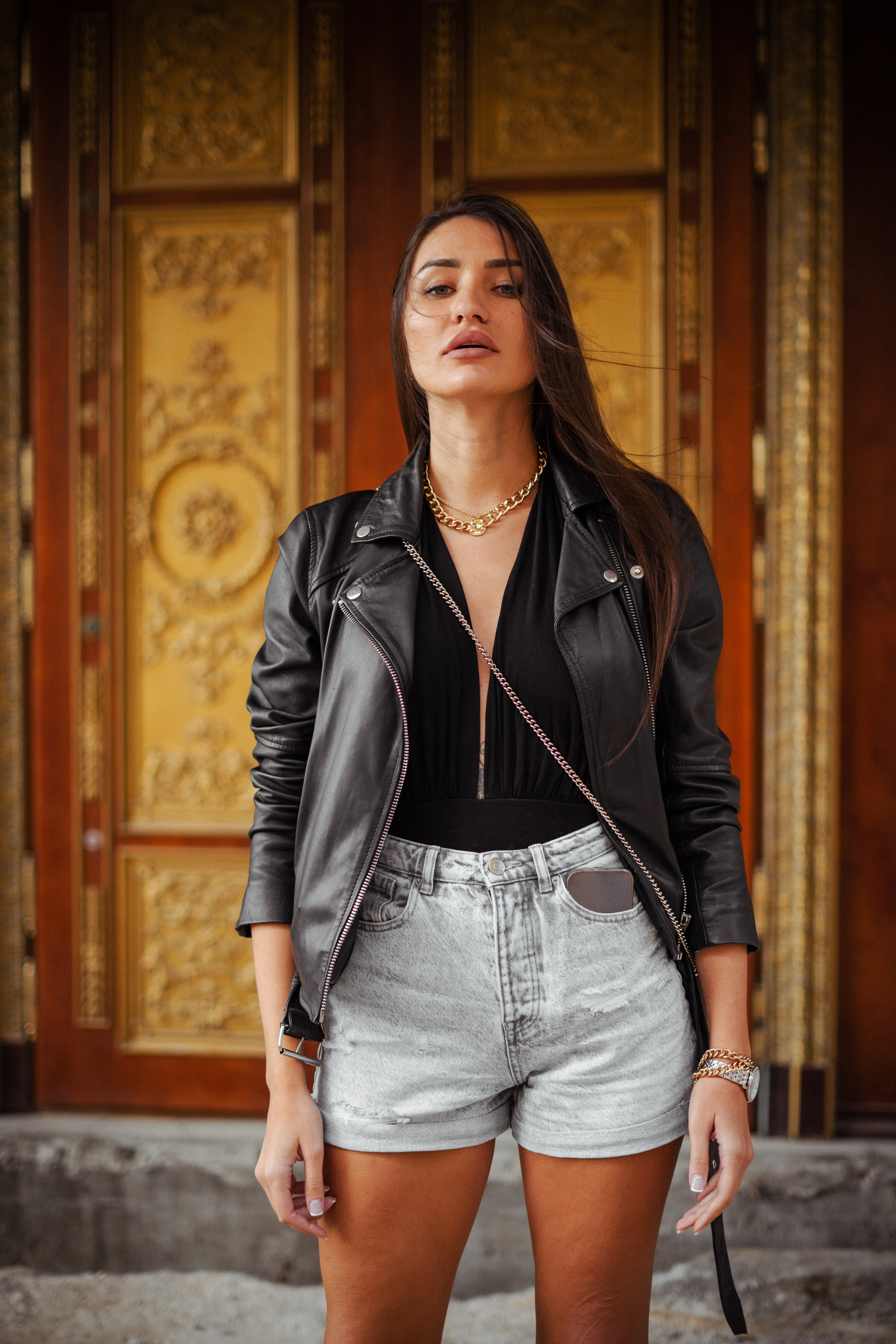 a girl with dark hair walking through the streets of Moscow