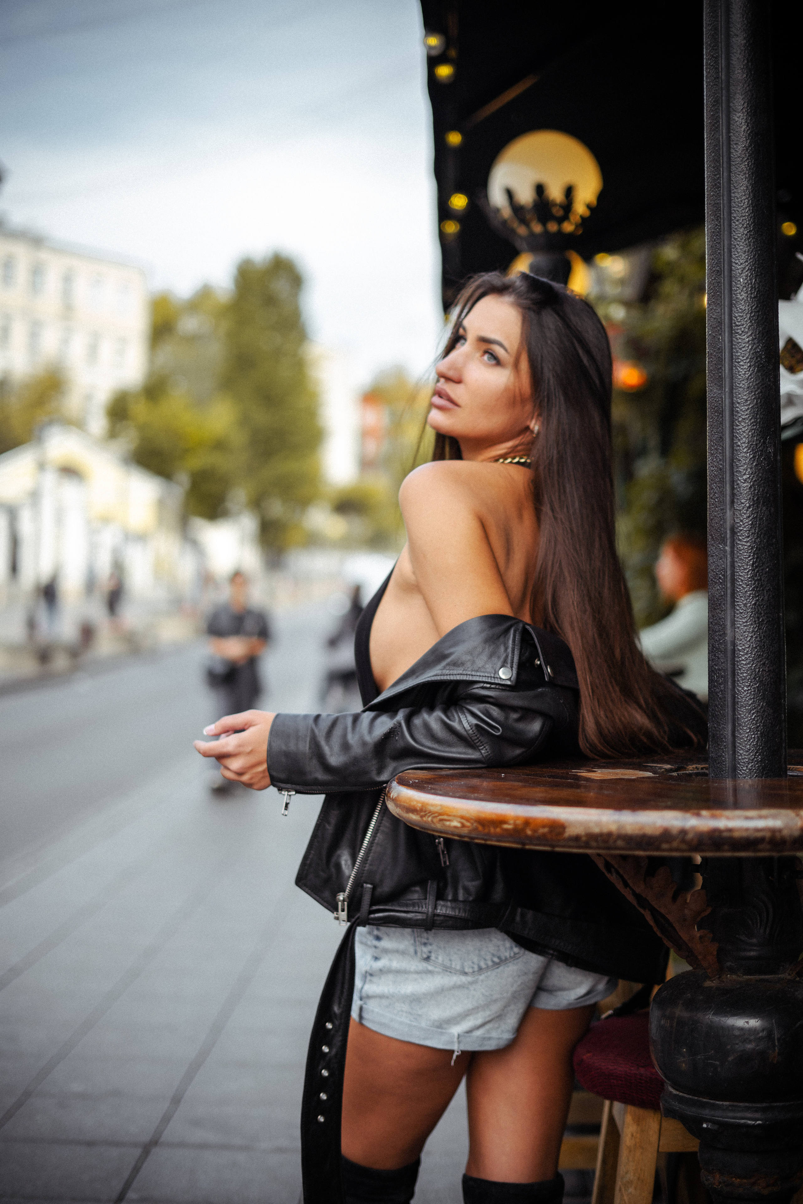 a beautiful dark-haired girl smiling on a Moscow street