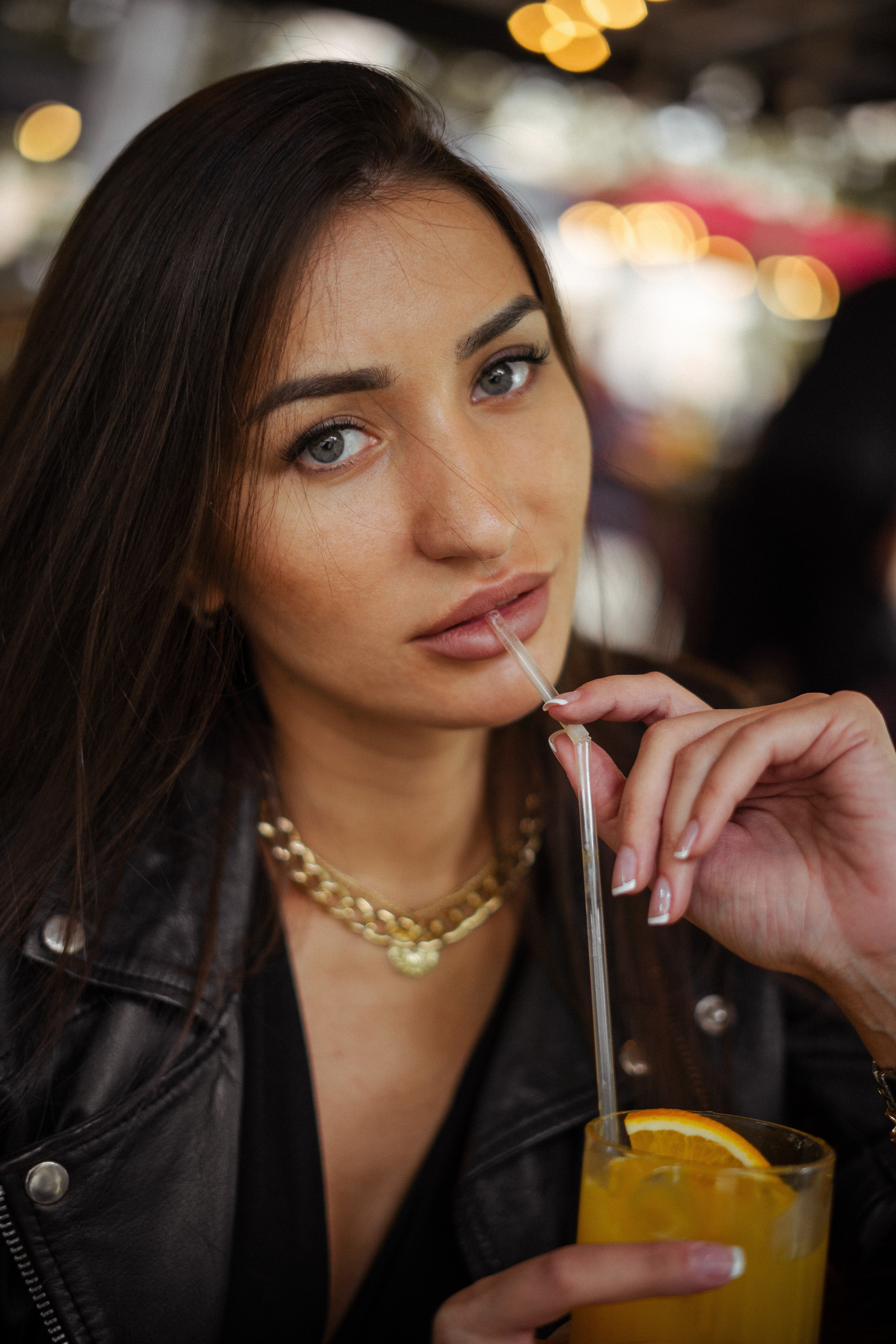 a dark-haired beauty by a historical building in Moscow