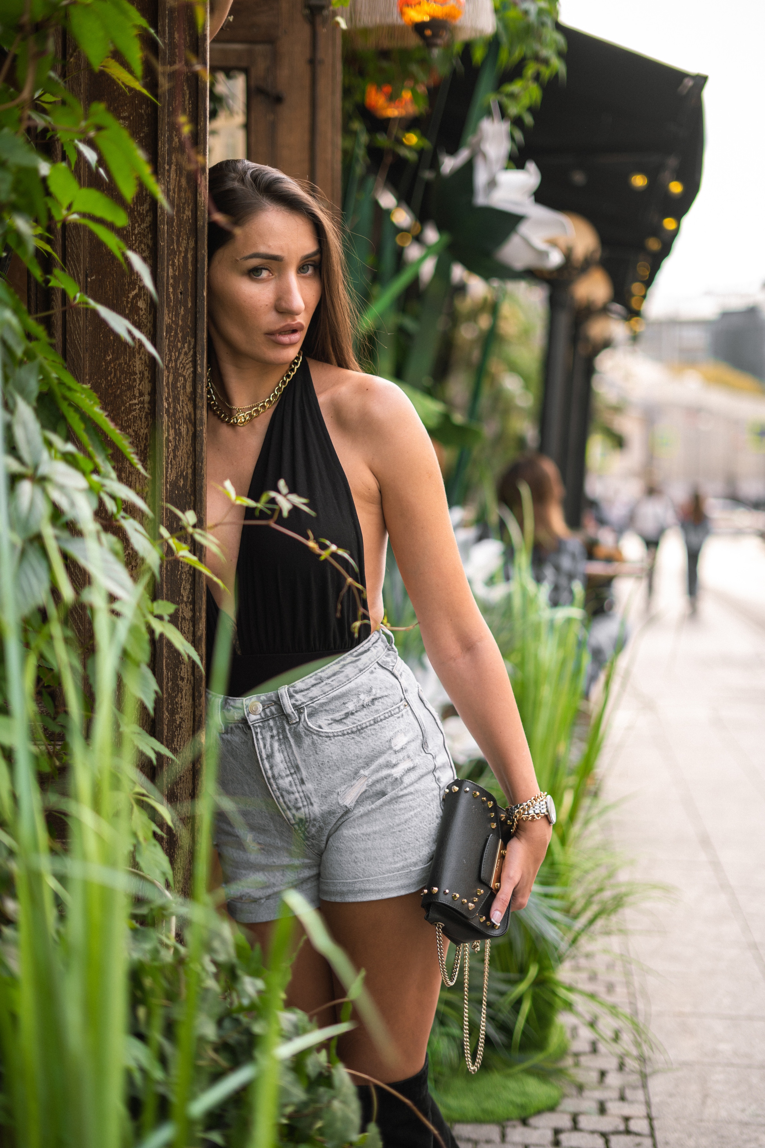 a beautiful dark-haired girl by street art in Moscow