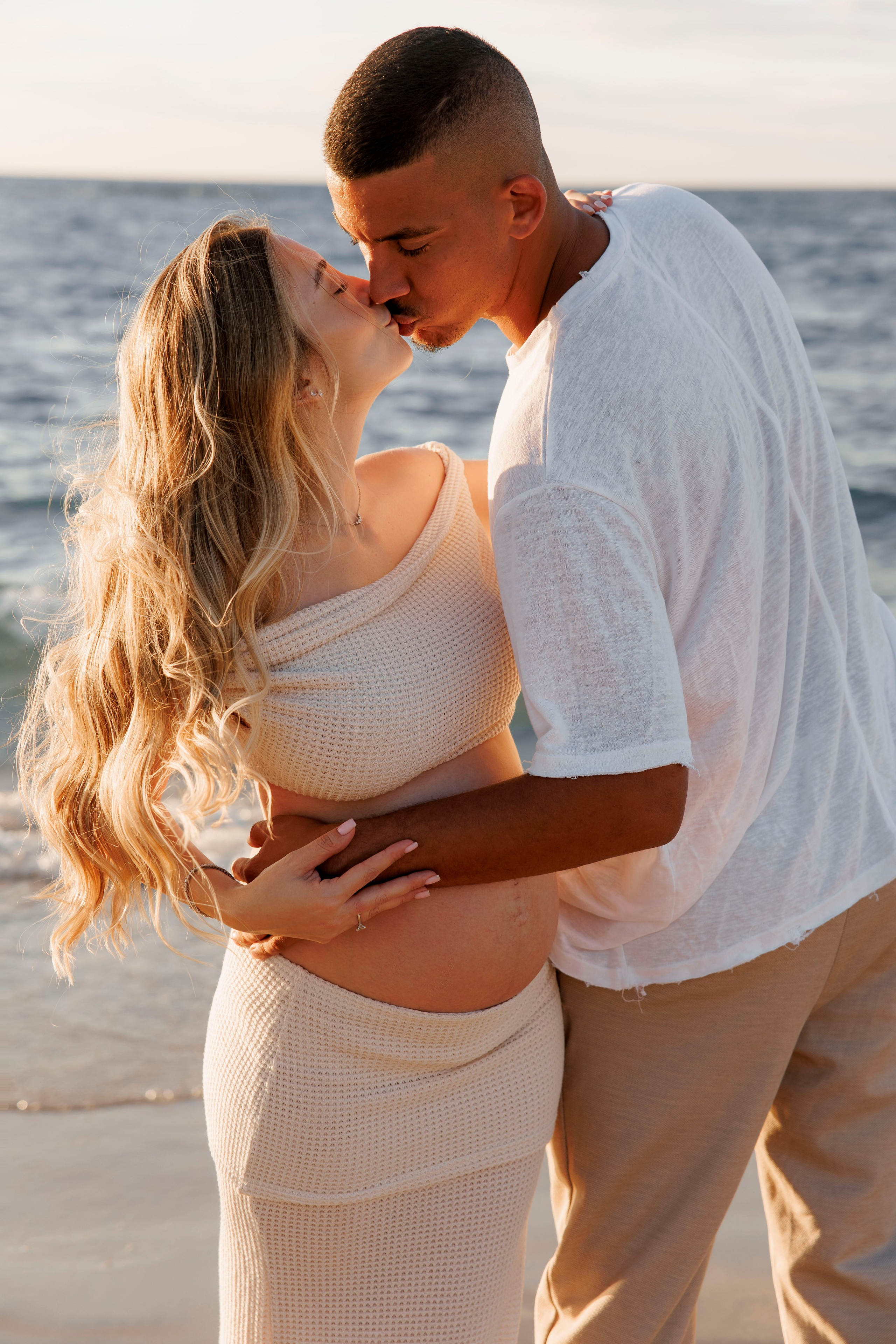 Pregnancy photoshoot near the sea. Wedding and family photographer