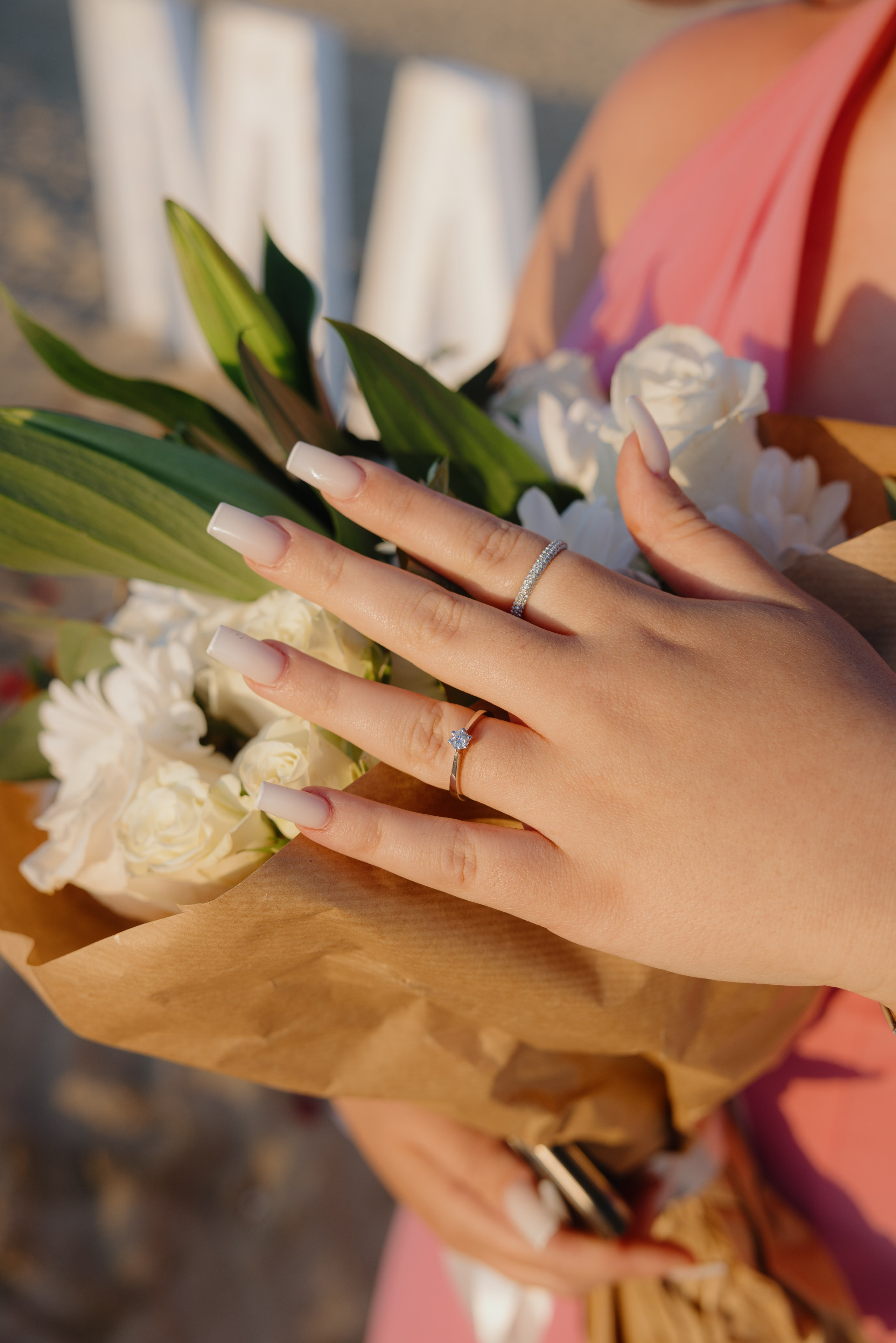 Close-up of the engagement ring on her finger, freshly engaged