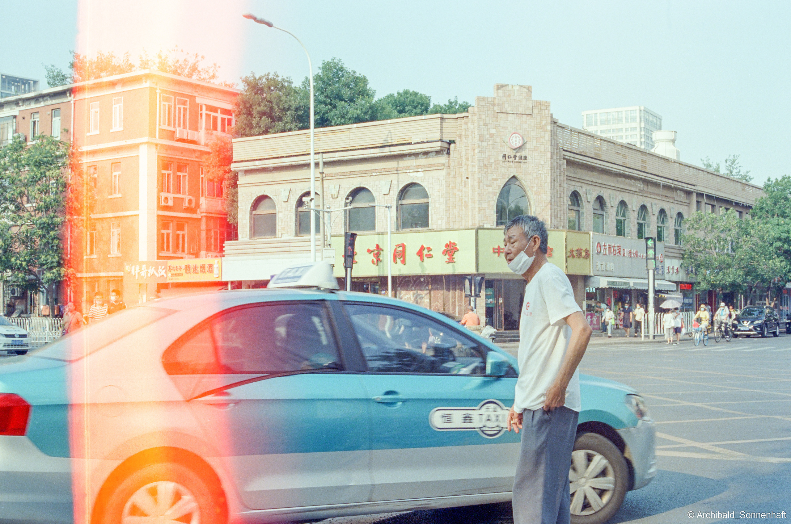 Yep, using film. Photographer in Guangzhou, China. Archibald Sonnenhaft