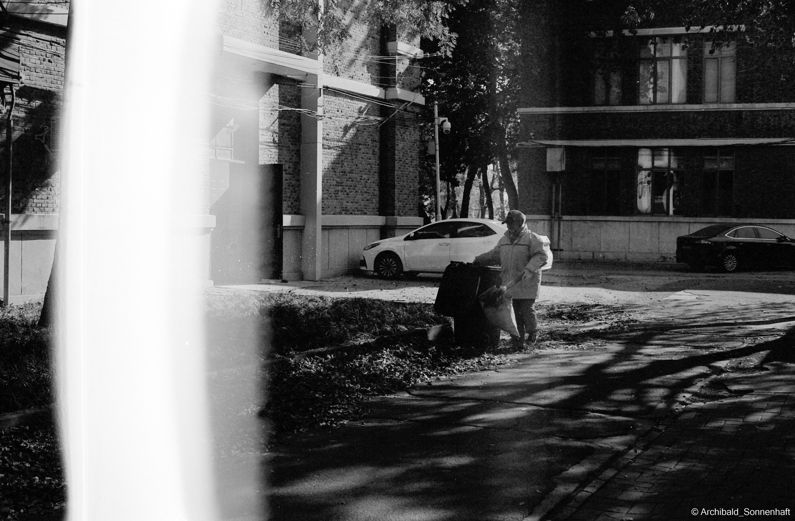 Yep, using film. Photographer in Guangzhou, China. Archibald Sonnenhaft