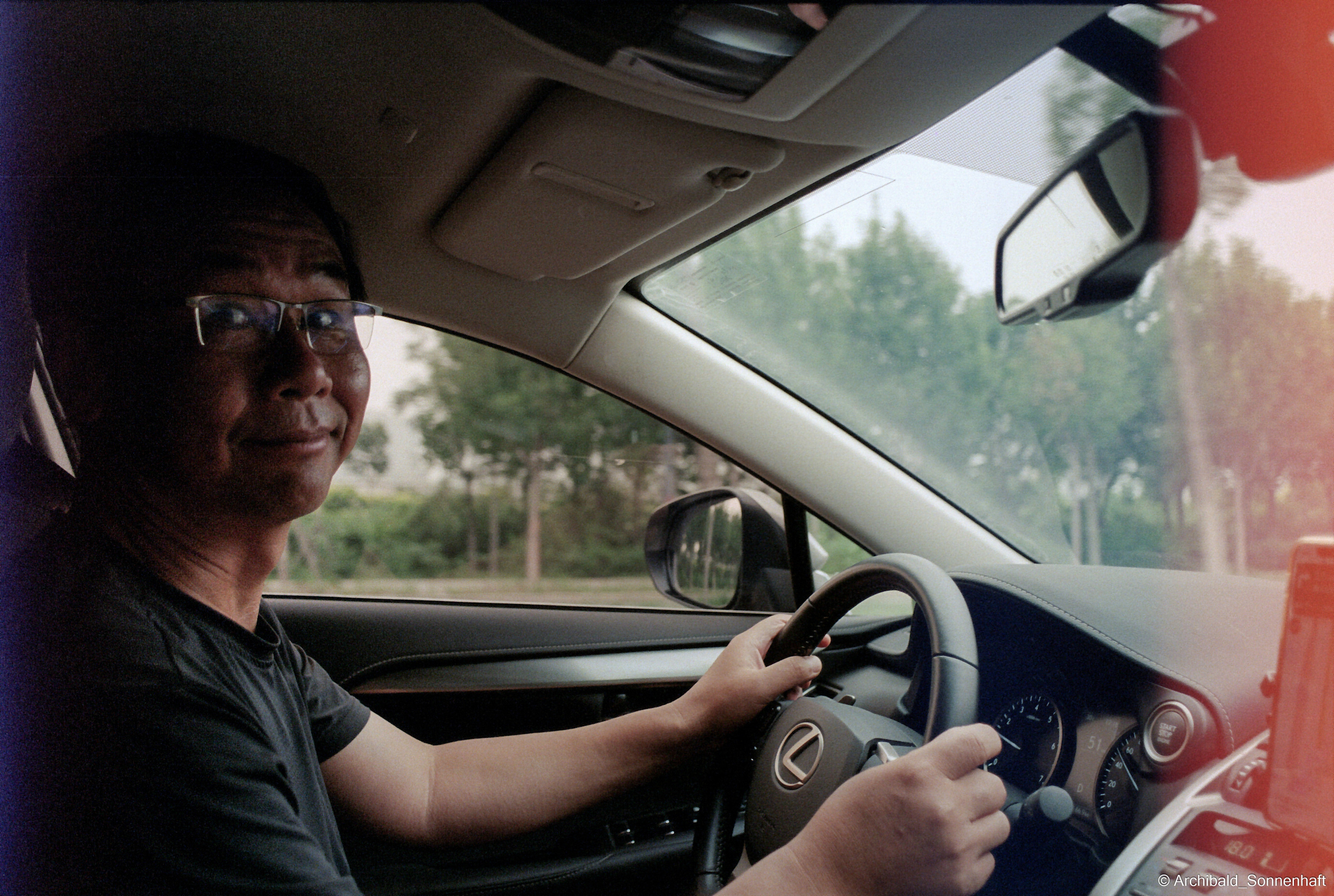 Yep, using film. Photographer in Guangzhou, China. Archibald Sonnenhaft
