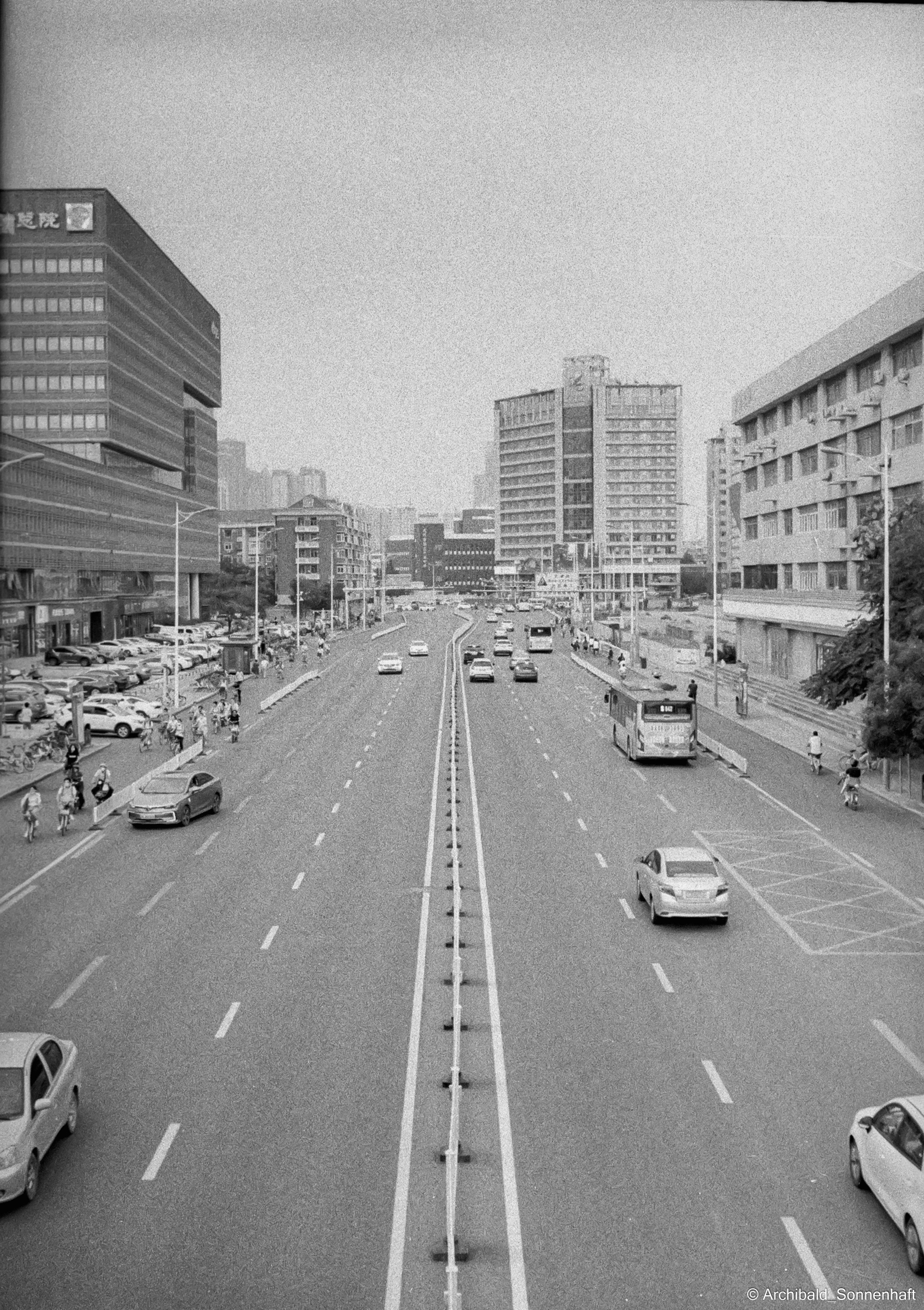 Yep, using film. Photographer in Guangzhou, China. Archibald Sonnenhaft