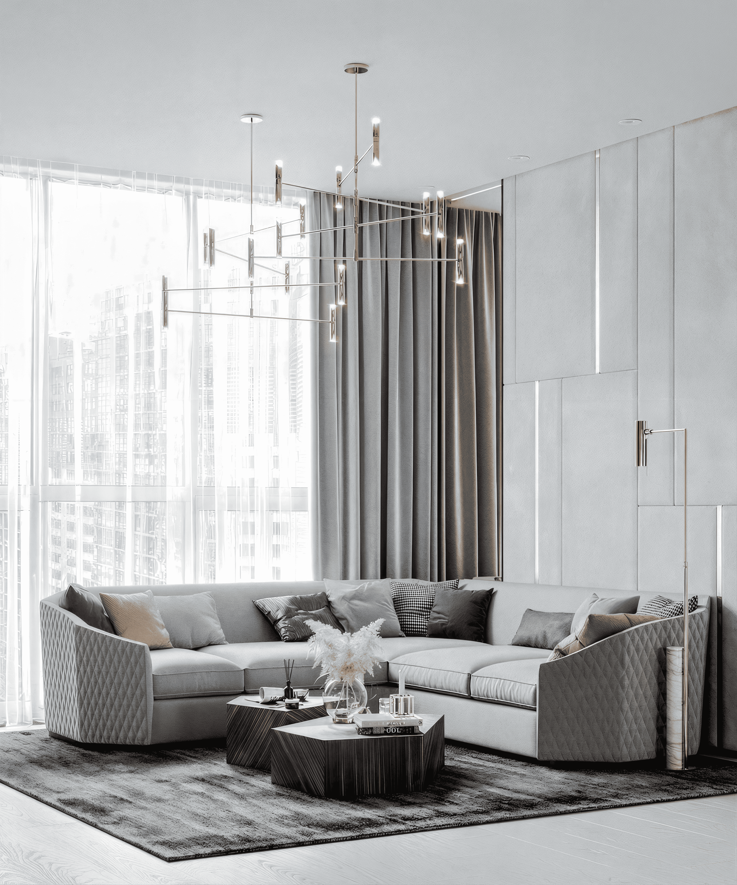 Премиальная гостиная от дизайнера Валерии Котович: большой серый угловой диван с ромбовидной стежкой, графичные журнальные столики, современная люстра-паук и стеновые панели с подсветкой.