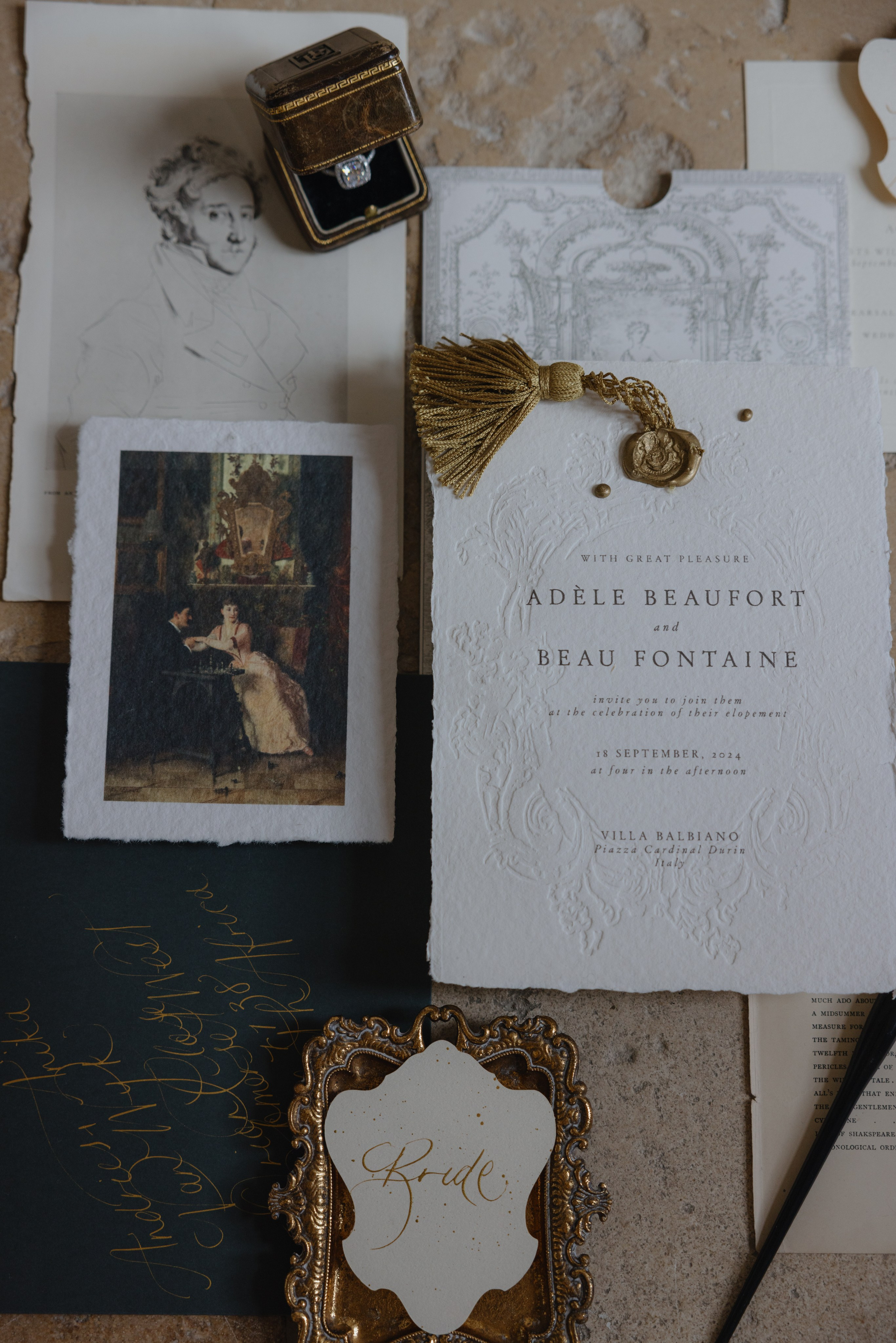 Luxury wedding details including rings and invitation design
