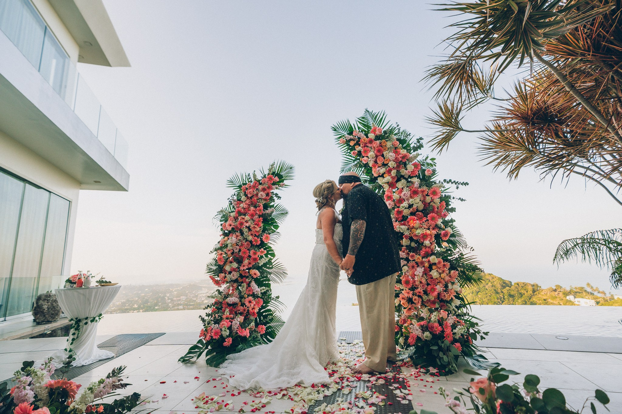 Bride and groom celebrating a sunset wedding at a villa in Koh Samui