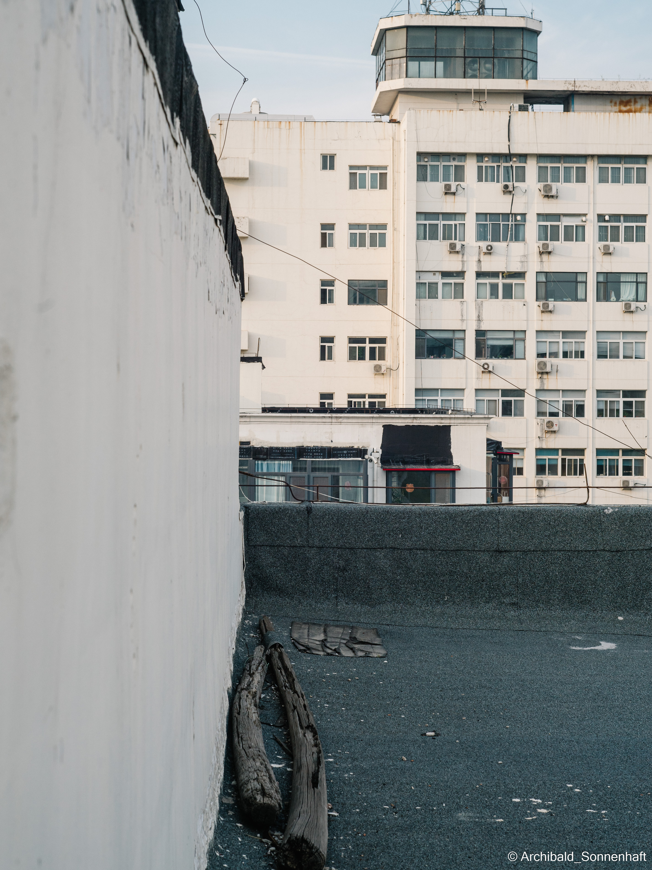 On the roof. Photographer in Guangzhou, China. Archibald Sonnenhaft