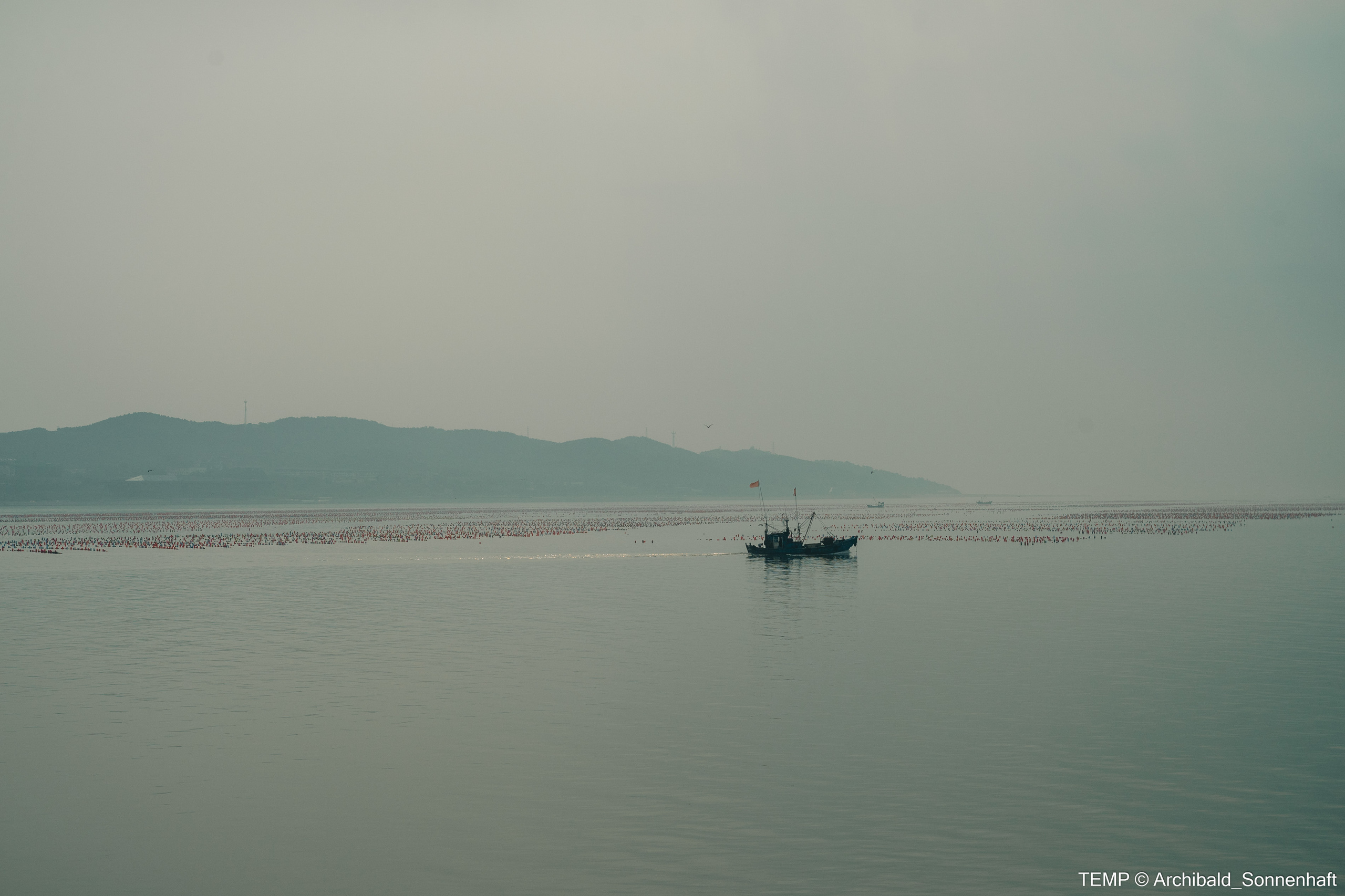 Small tourist island (Yantai district, China). Photographer in Guangzhou, China. Archibald Sonnenhaft