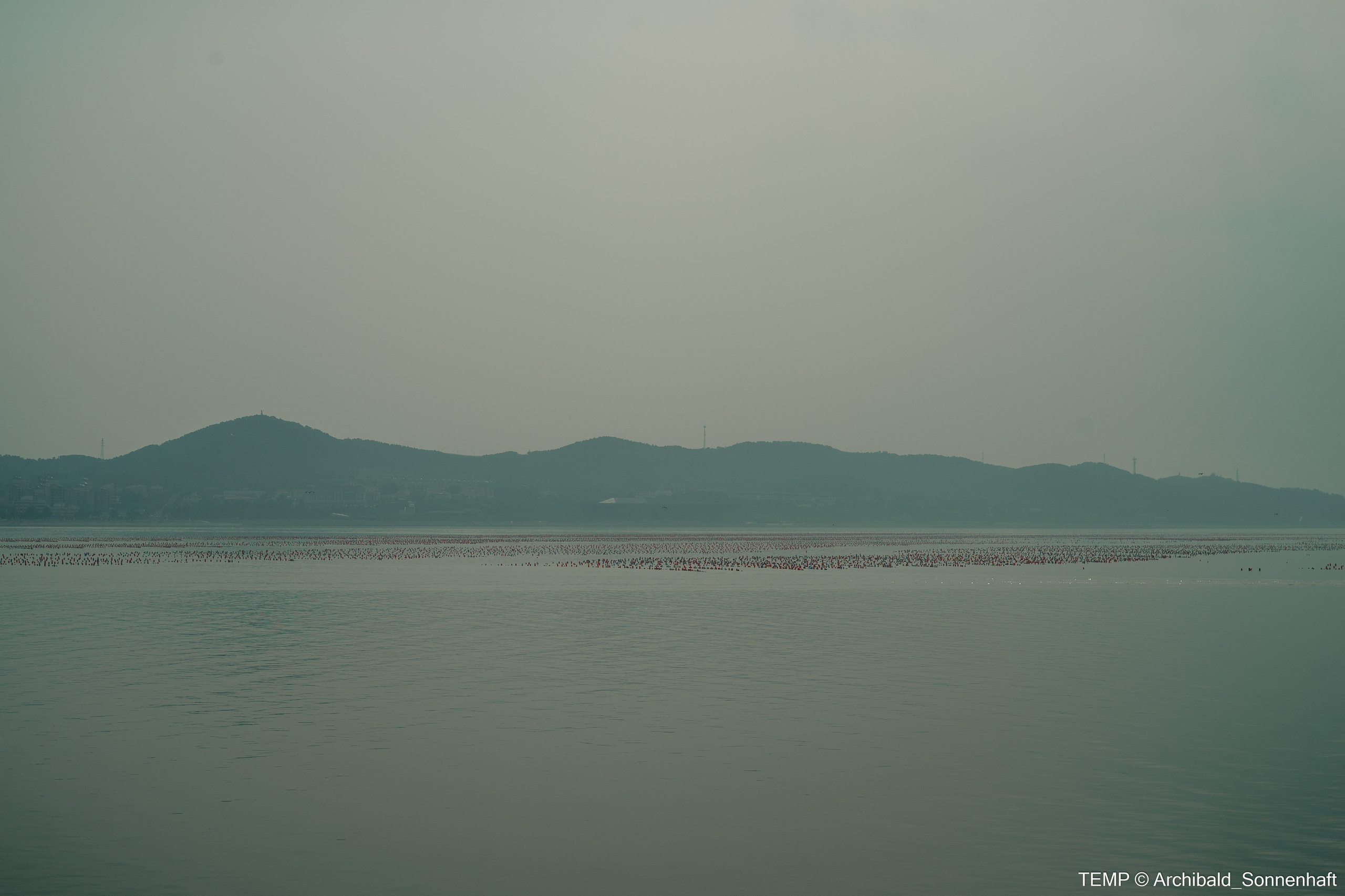 Small tourist island (Yantai district, China). Photographer in Guangzhou, China. Archibald Sonnenhaft