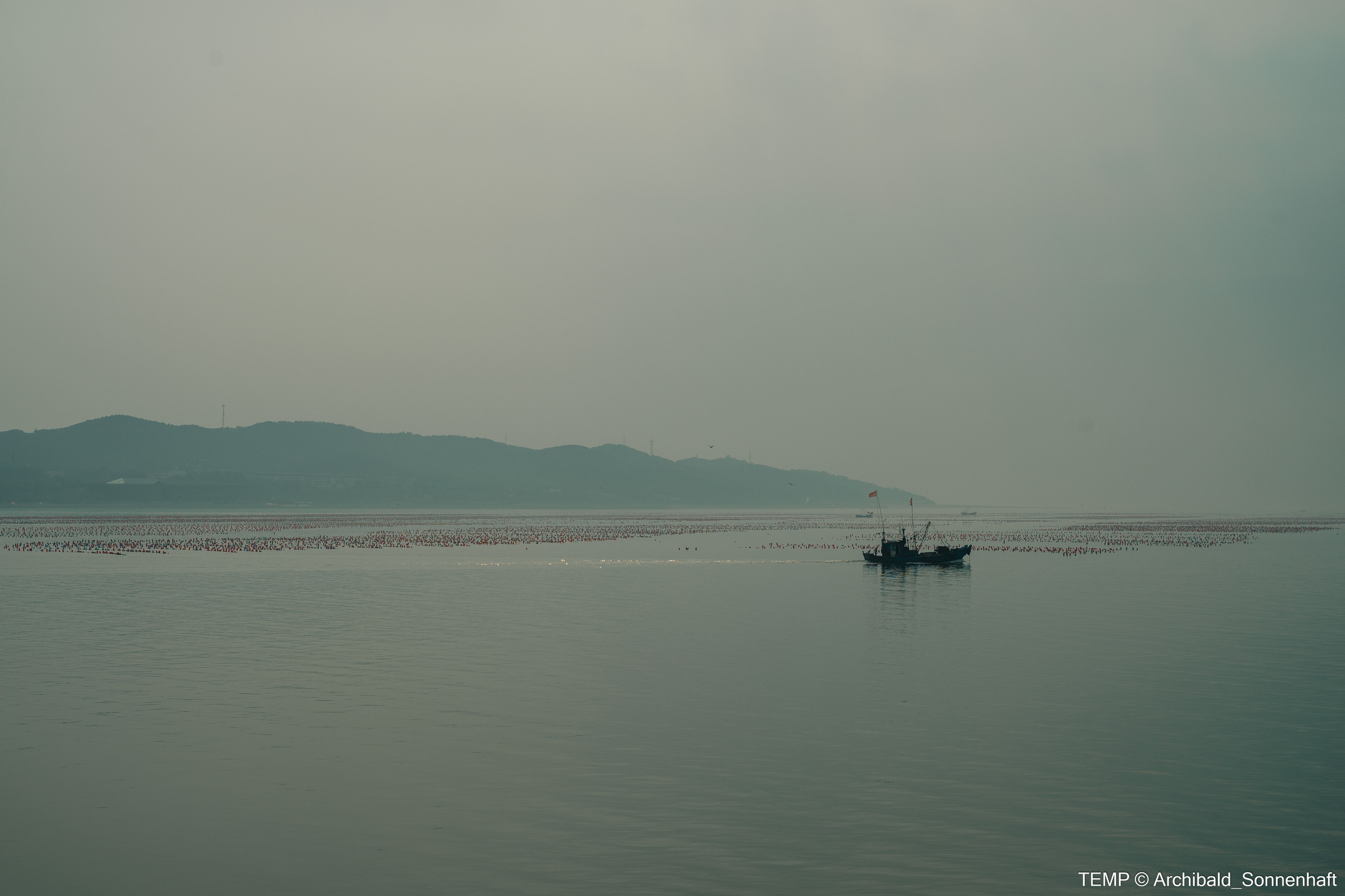 Small tourist island (Yantai district, China). Photographer in Guangzhou, China. Archibald Sonnenhaft
