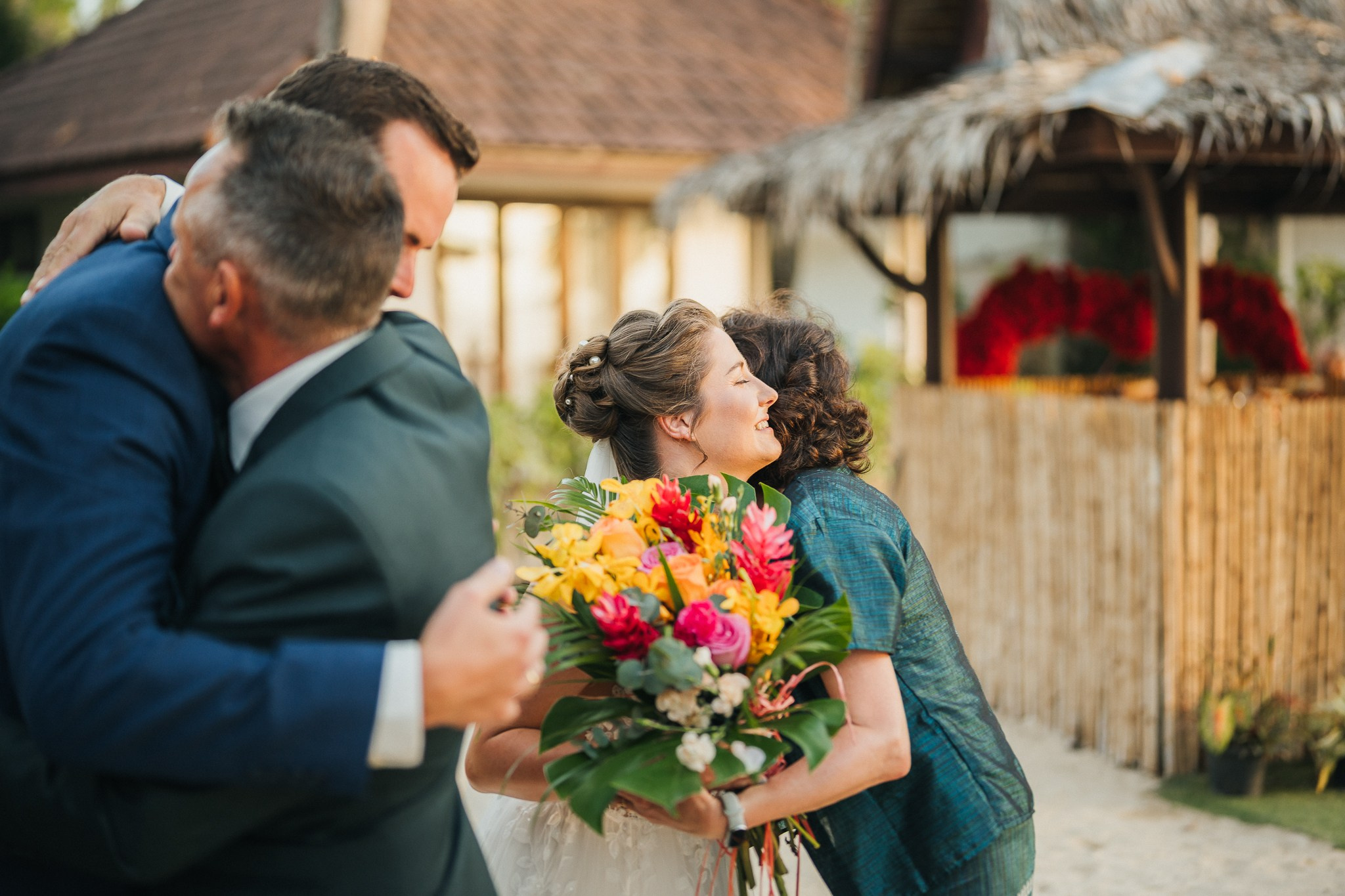 Destination beach wedding in Koh Samui, Thailand with the couple, family members and friends enjoying a tropical wedding ceremony by the sea