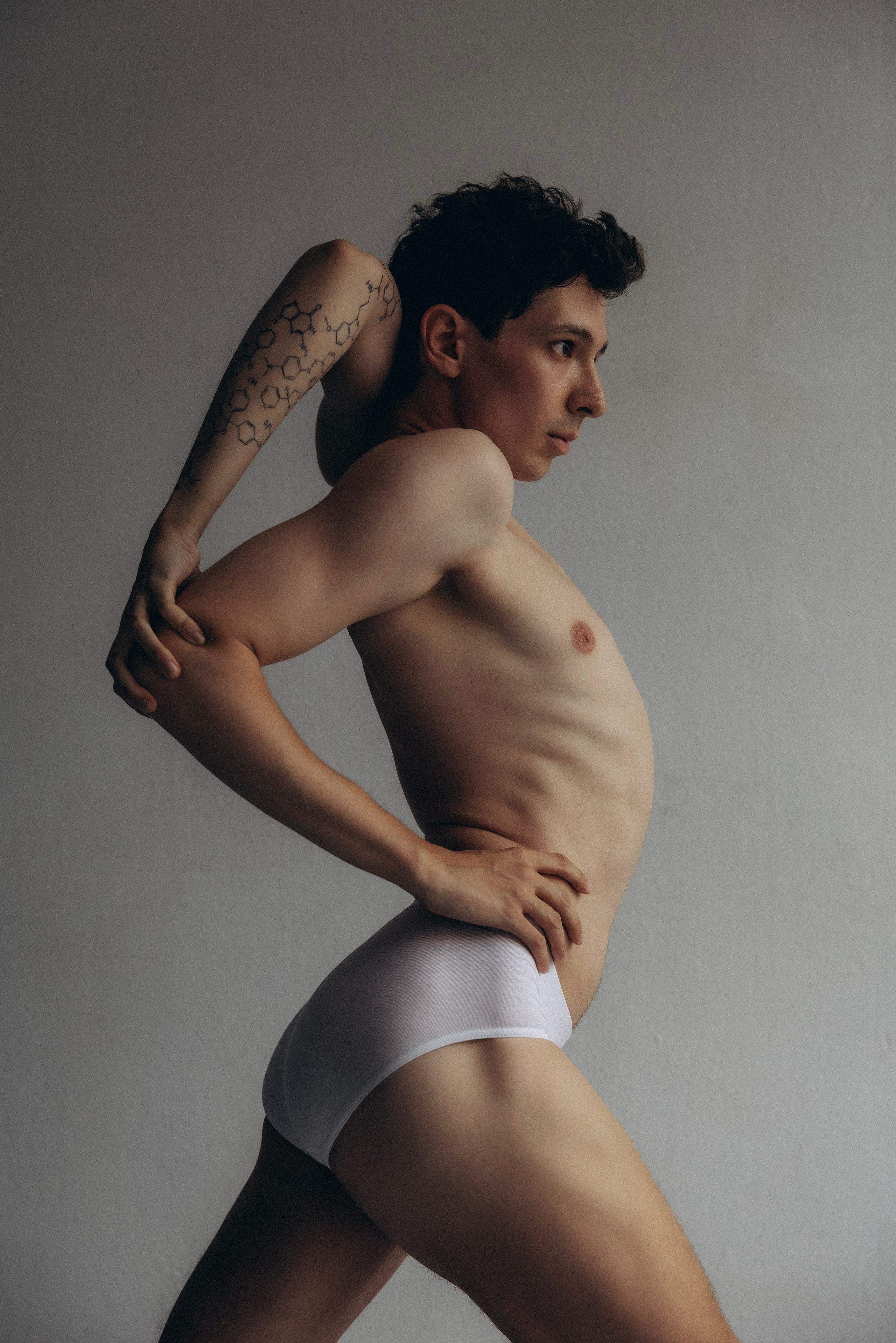 Creative Barcelona studio photography of a male model showing body flexibility