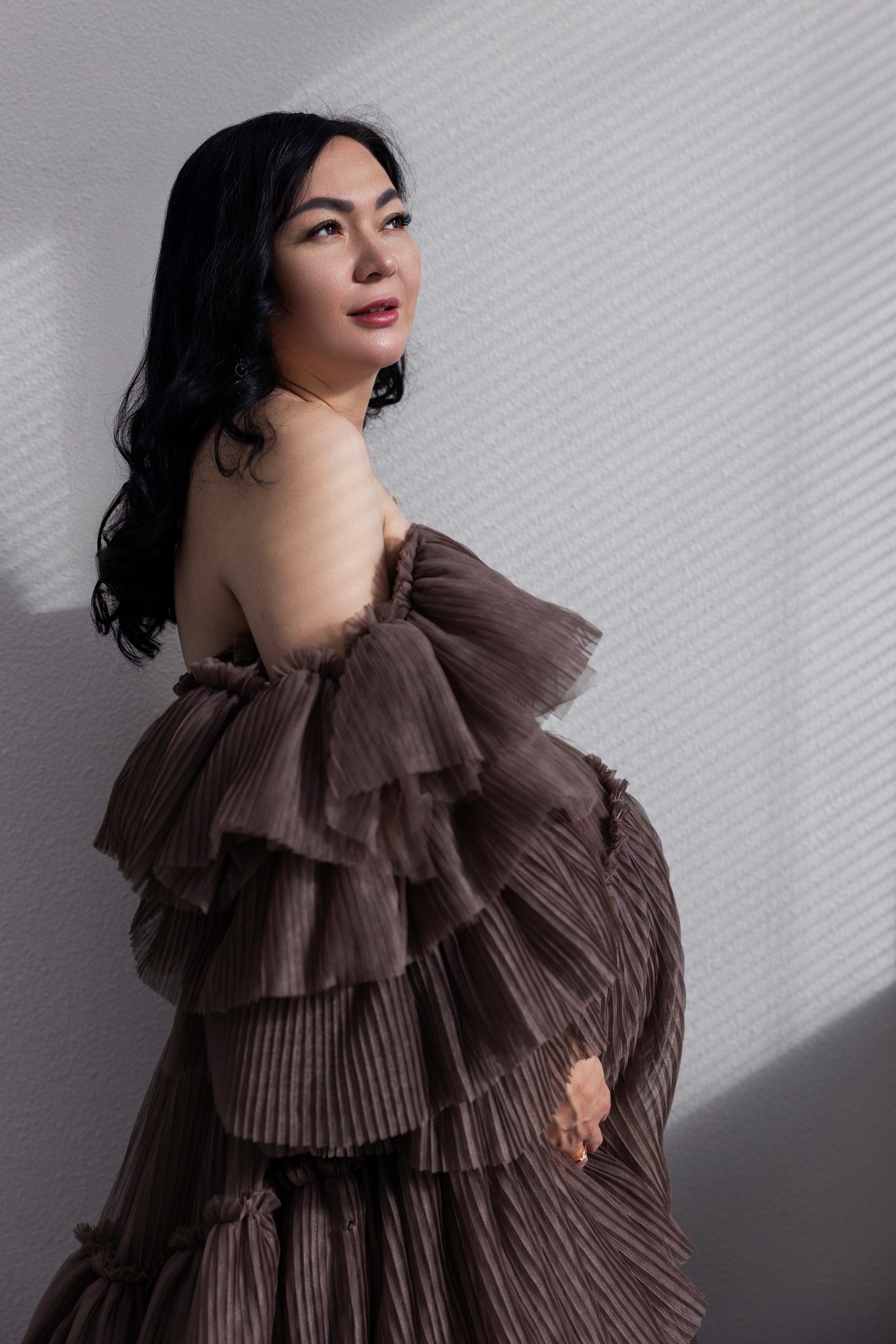 Pregnancy photo session with husband in studio