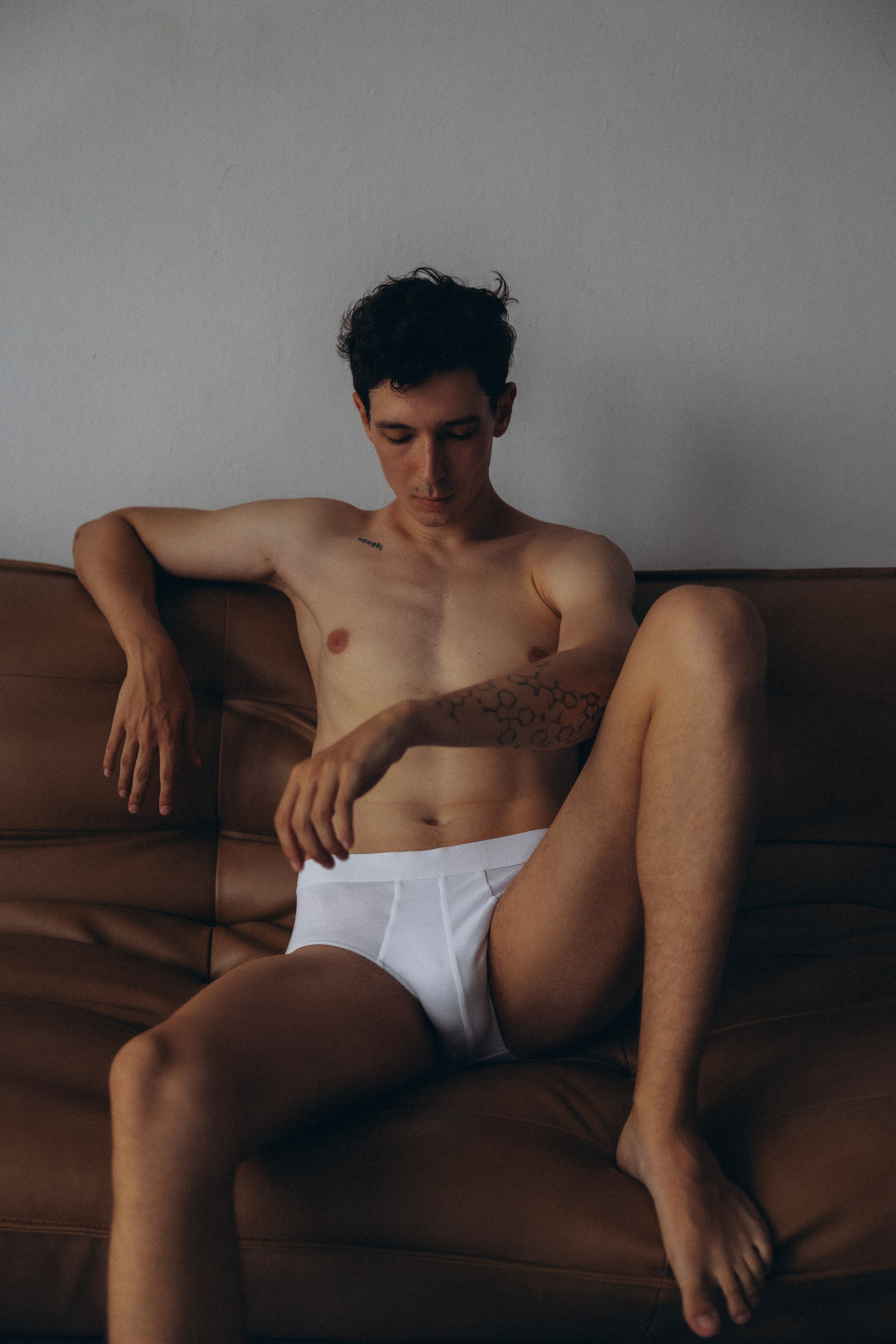 Minimalist black and white yoga pose on concrete blocks in Barcelona studio