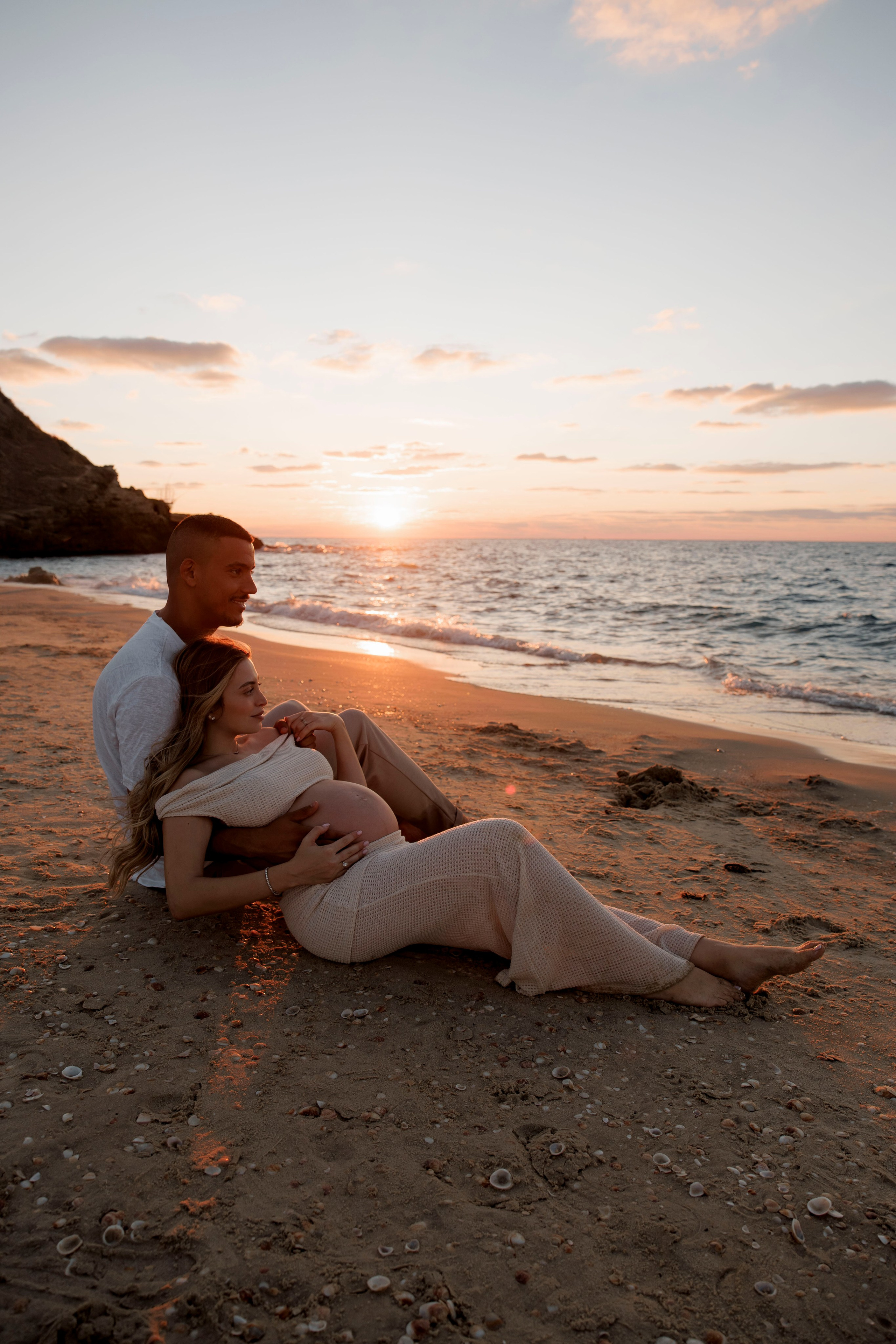 Pregnancy photoshoot near the sea. Wedding and family photographer