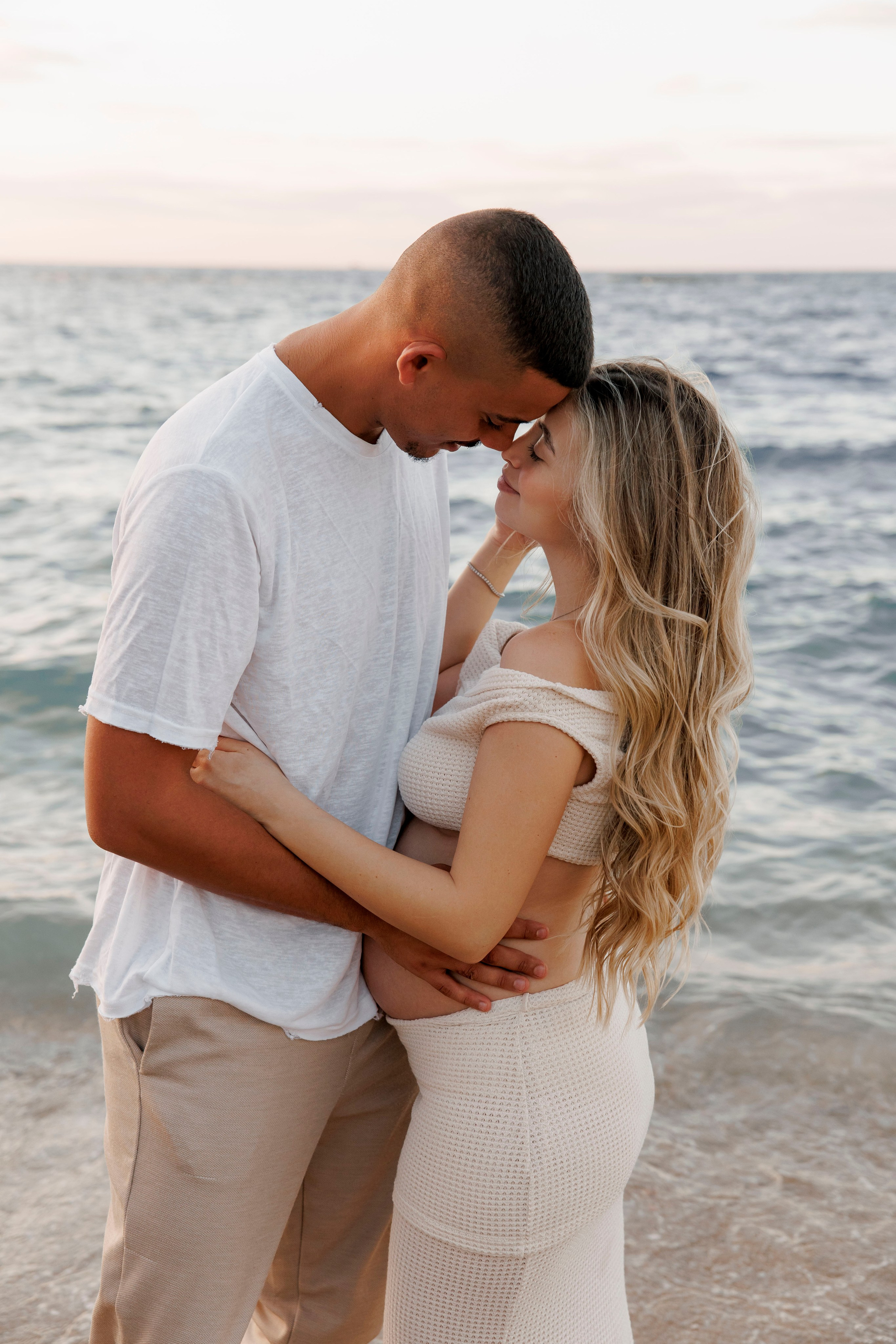 Pregnancy photoshoot near the sea. Wedding and family photographer