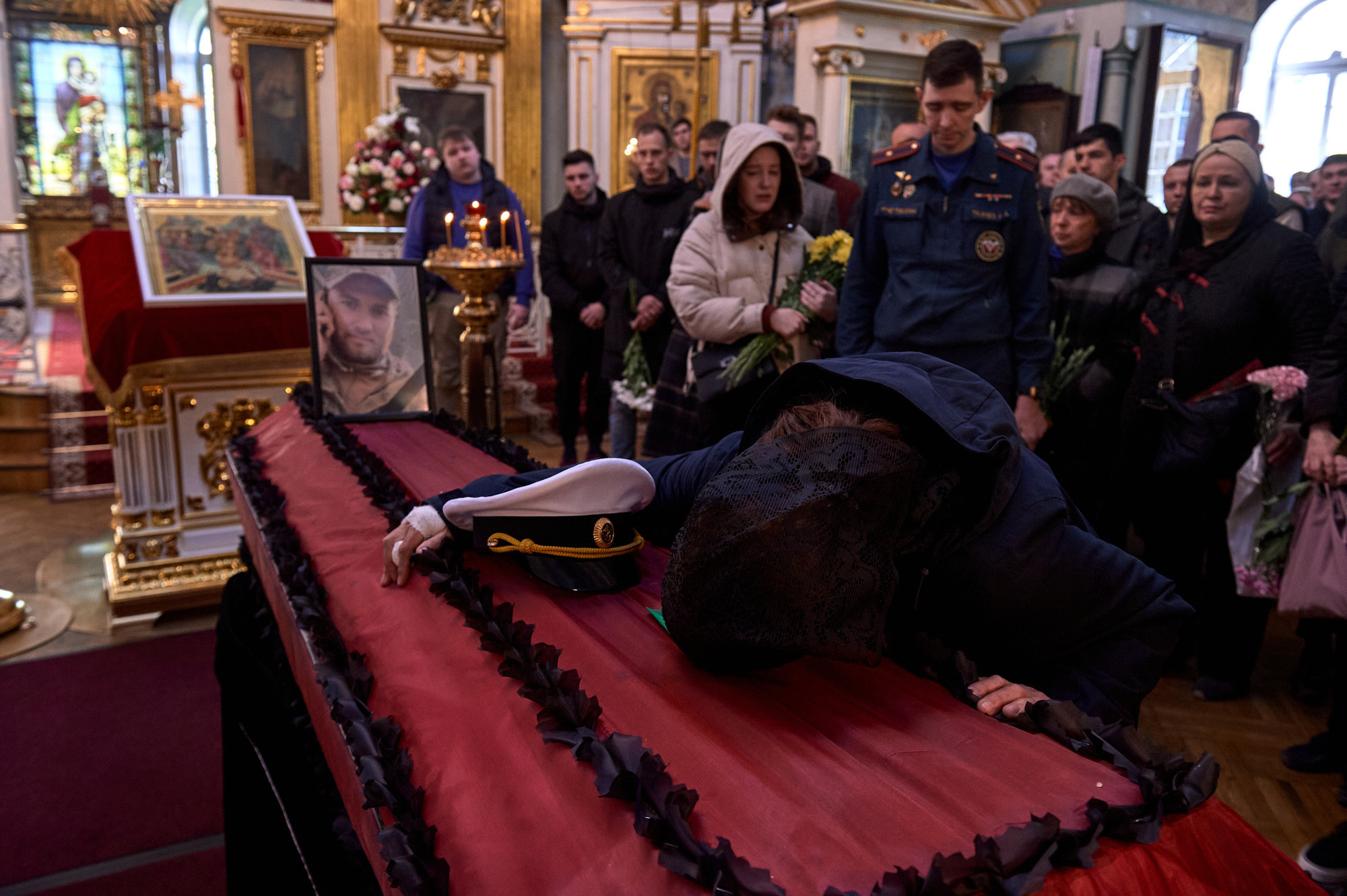 A mother cries at the funeral of her son, 24-year-old petty officer Aleksei Fyodorov, who was killed aboard a patrol boat near Snake Island. St. Petersburg, May 18, 2022.