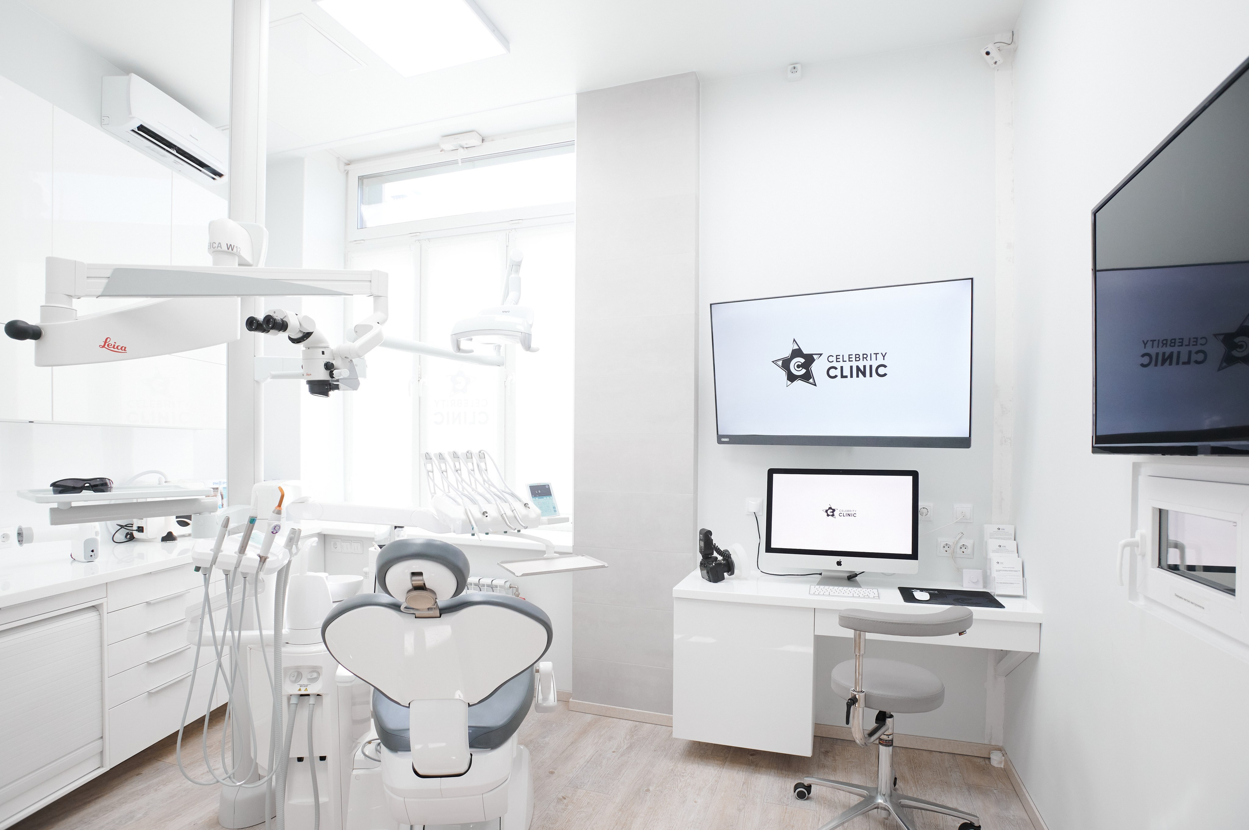Современный стоматологический кабинет с панорамным окном и новым креслом. Профессиональная съемка интерьера клиники