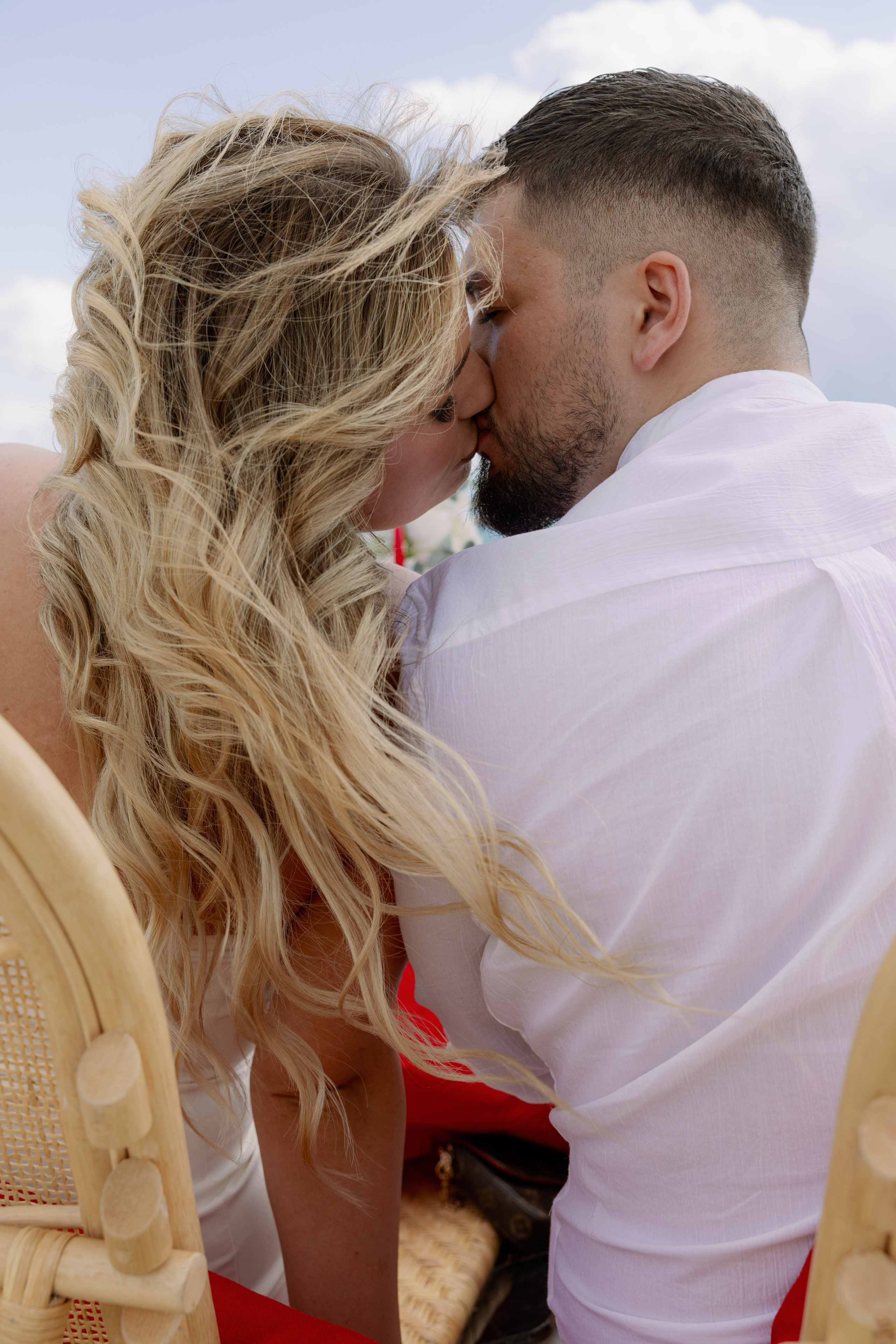 Man proposing in front of colorful Gaudí architecture