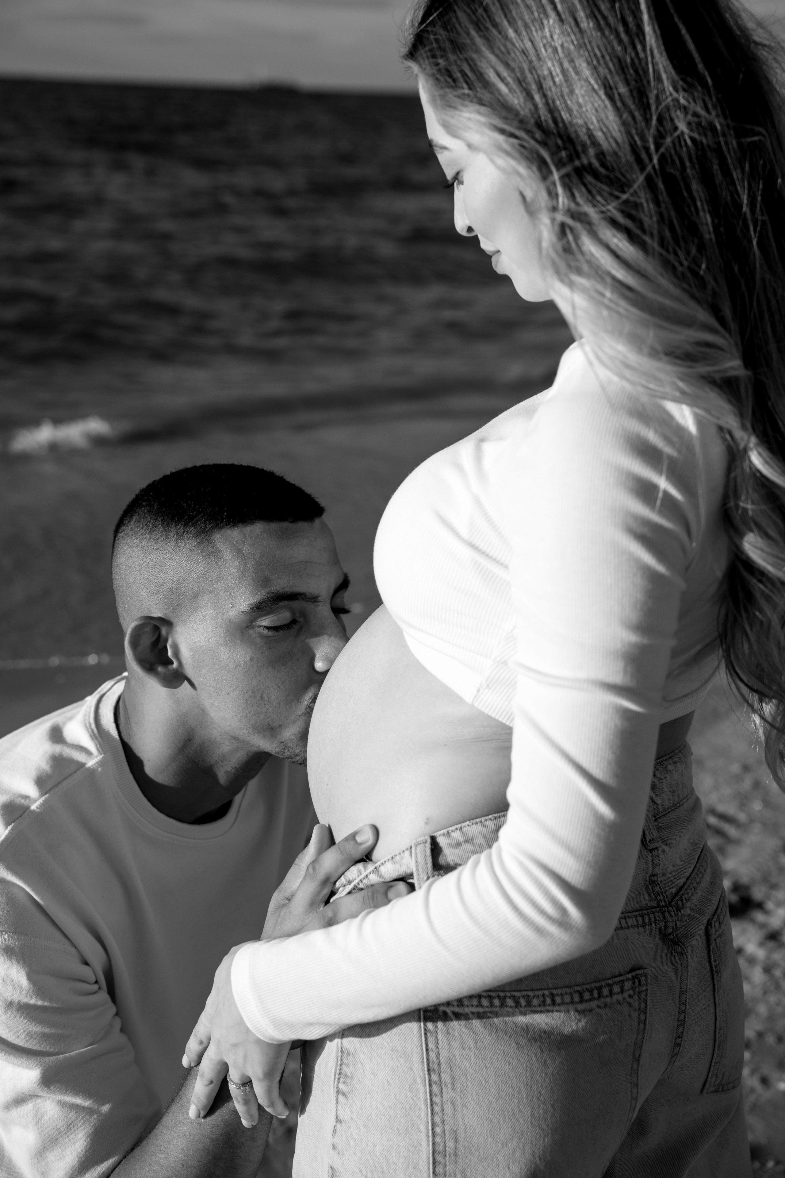 Pregnancy photoshoot near the sea. Wedding and family photographer