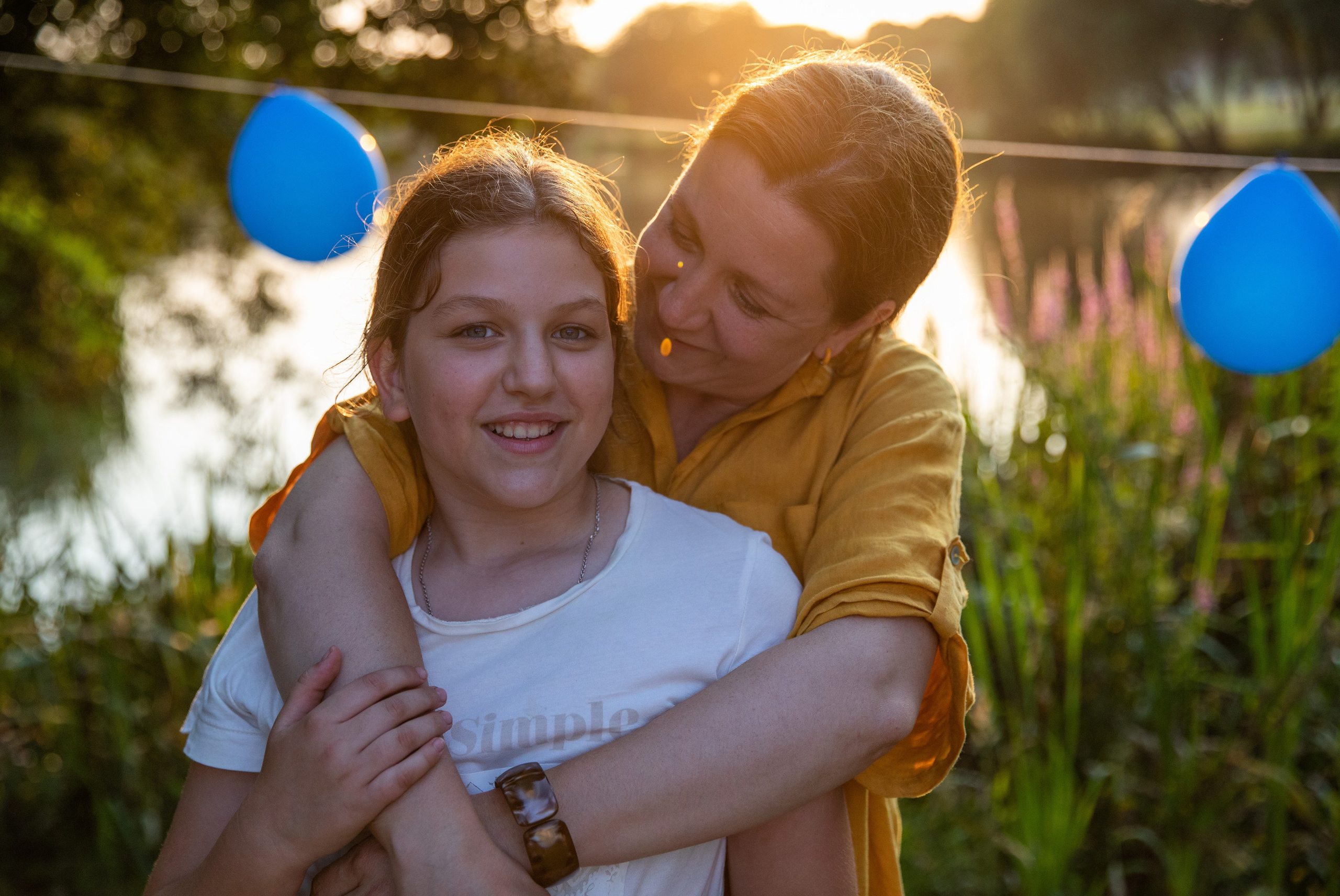Many children celebrate their friend's birthday in the park