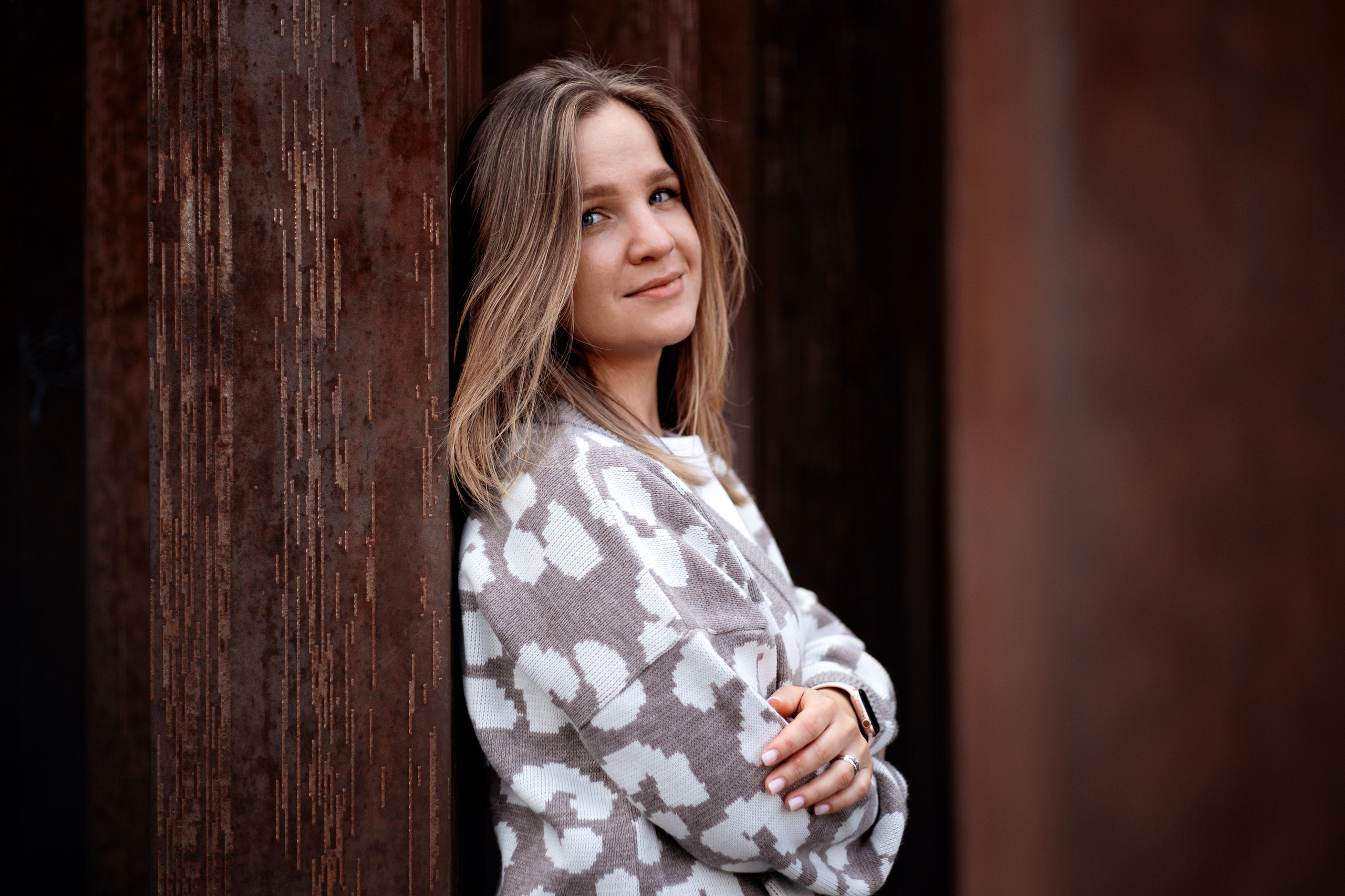 photo of a girl at a rusty structure