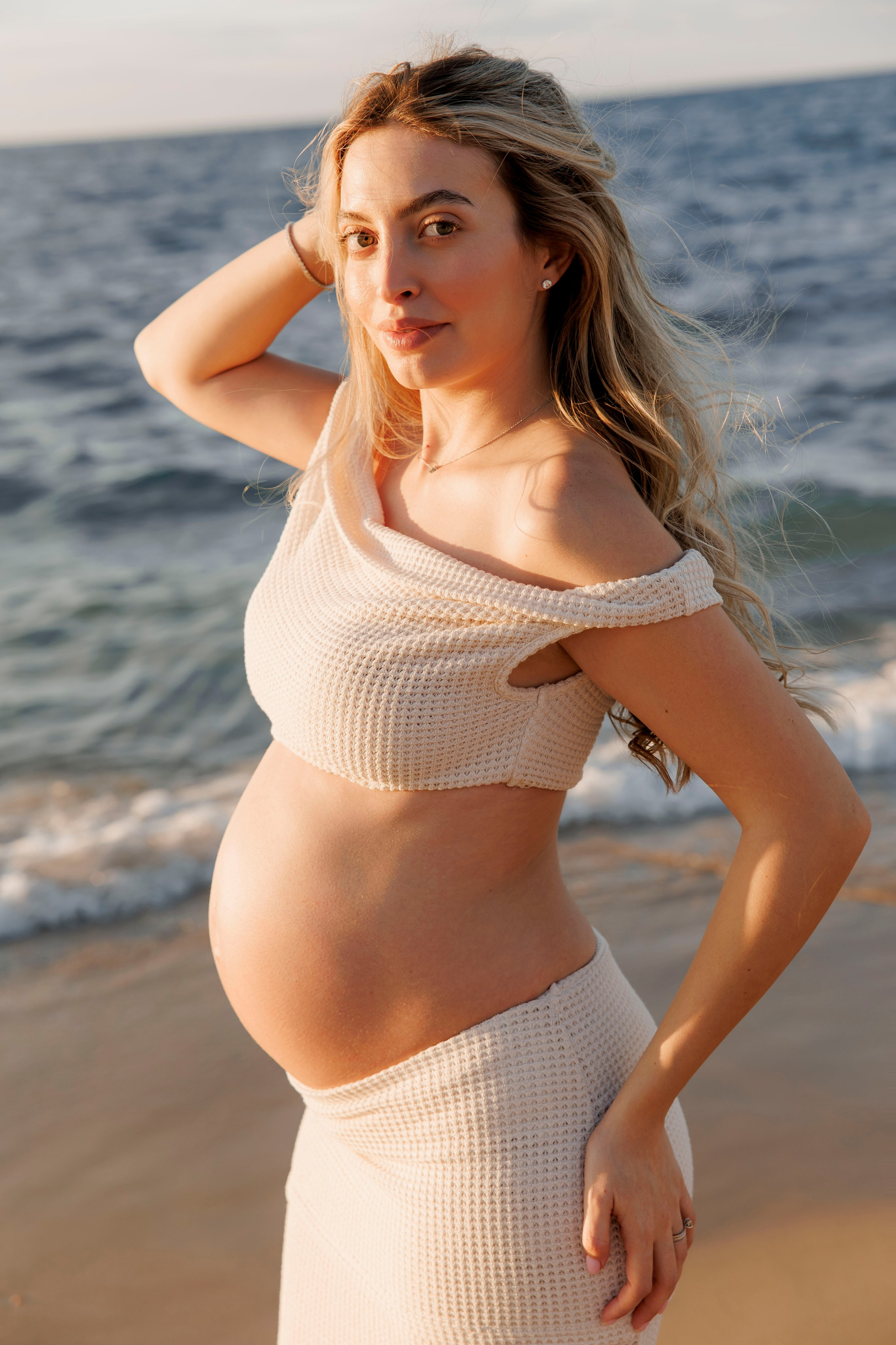 Pregnancy photoshoot near the sea. Wedding and family photographer