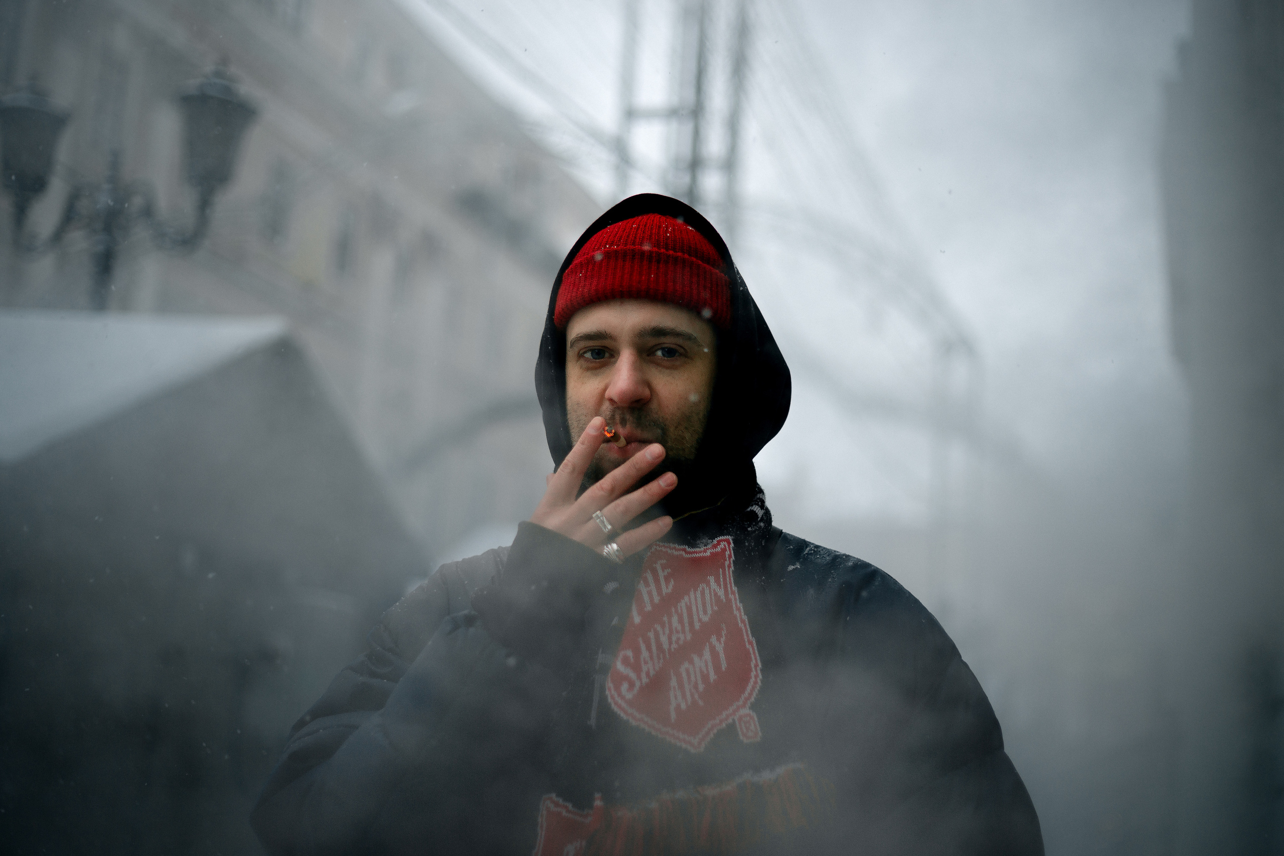A man's cigarette in smoke
