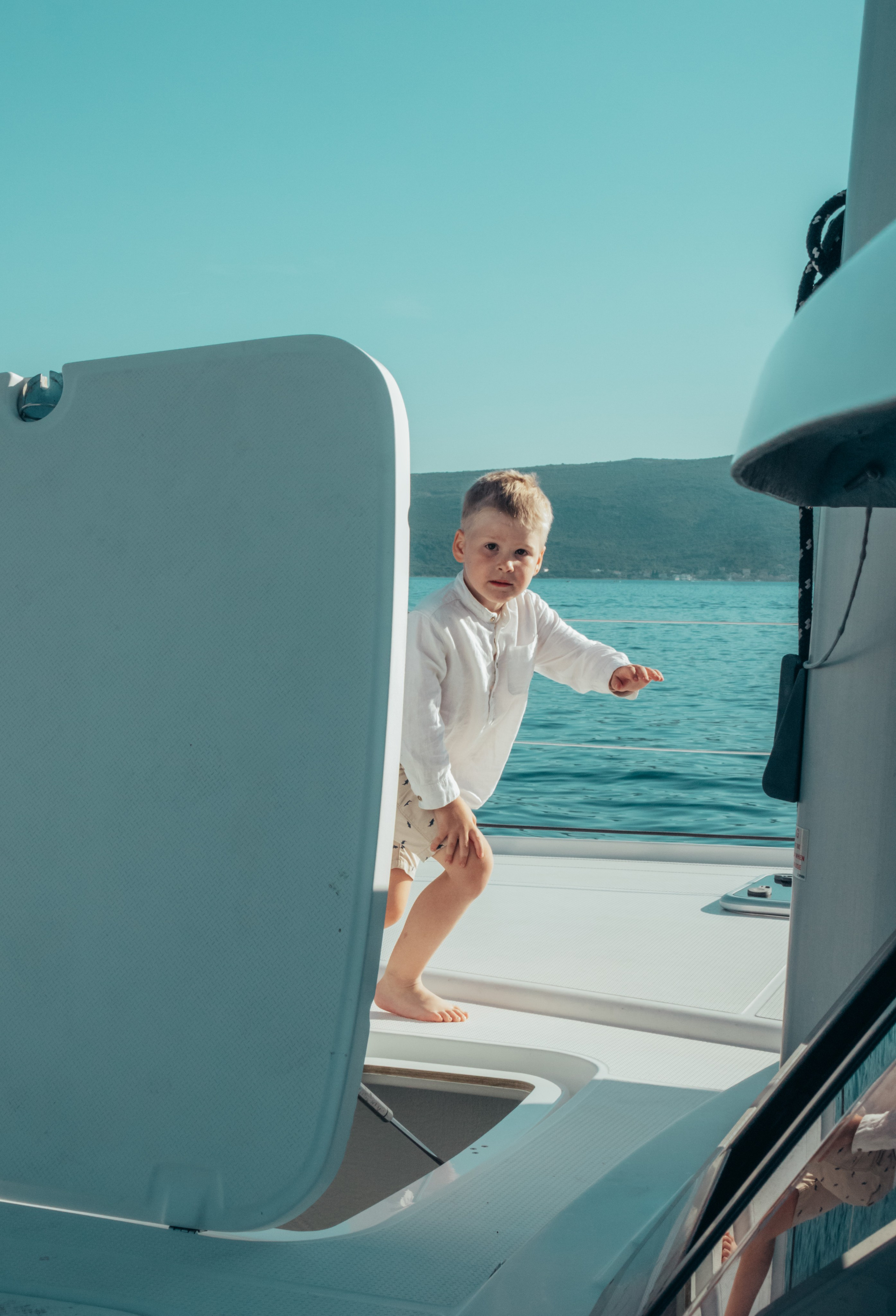 Boat tour with Anna, Roman and Tim. Portrait photographer in Tivat Montenegro Katerina Kirsanova