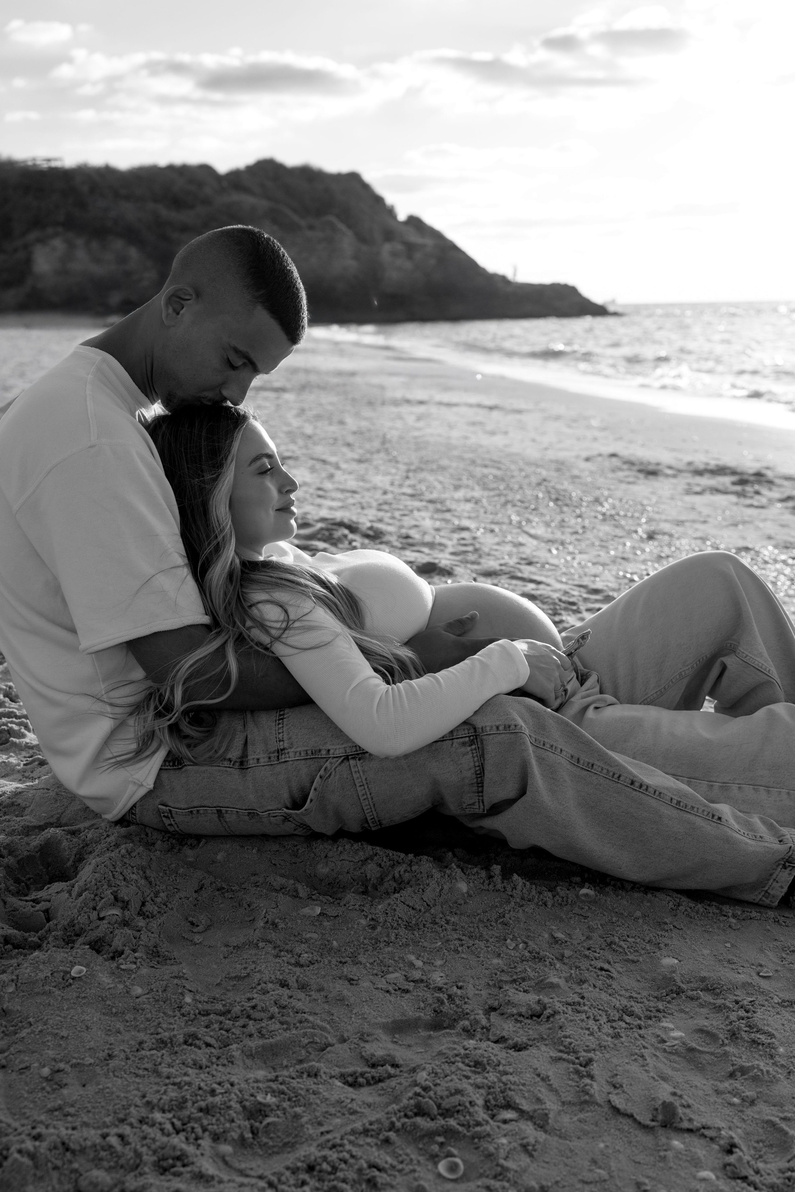 Pregnancy photoshoot near the sea. Wedding and family photographer