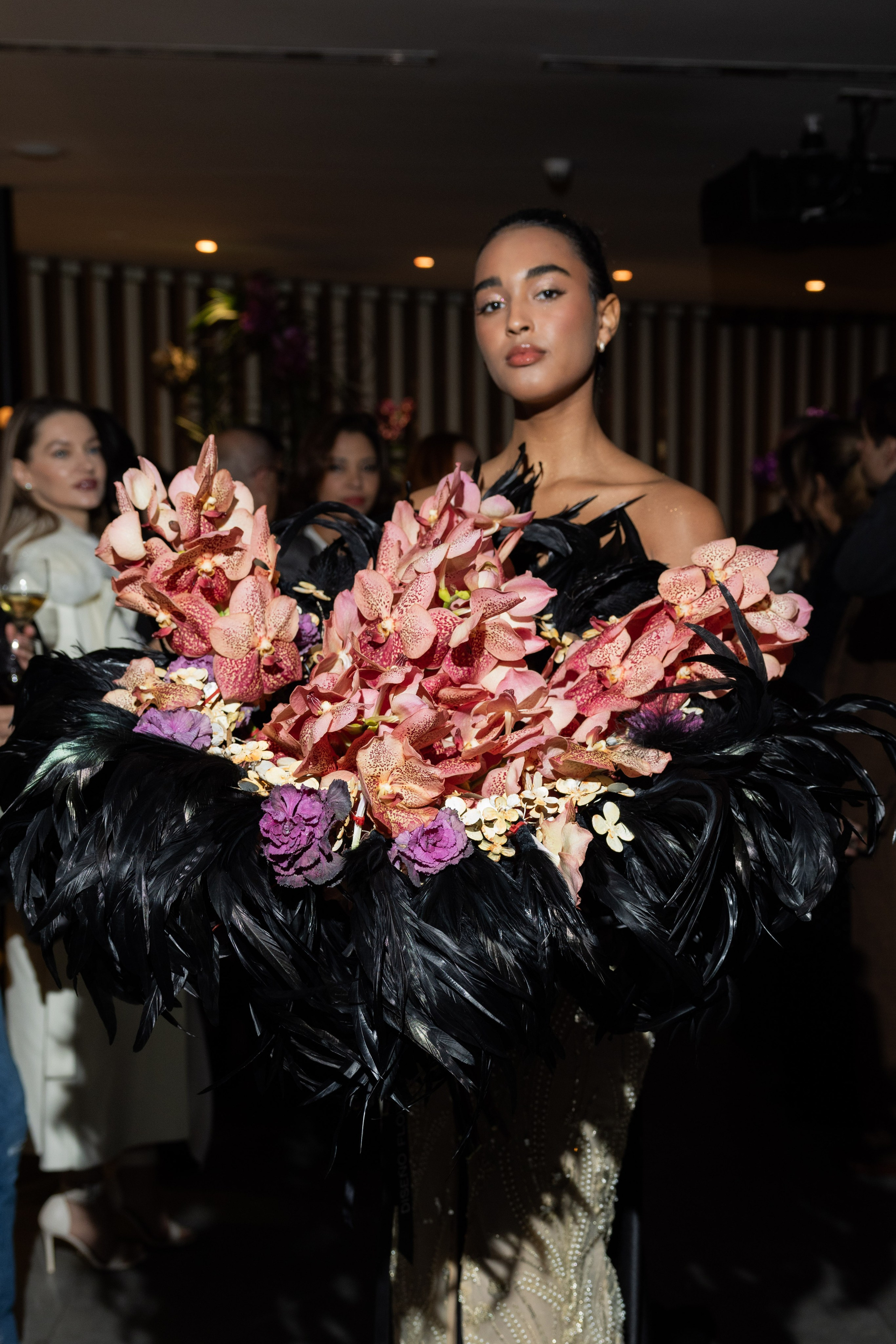 VIP attendees enjoying Araik Galstyan’s floral art at the exclusive Meliá Hotel Barcelona party.