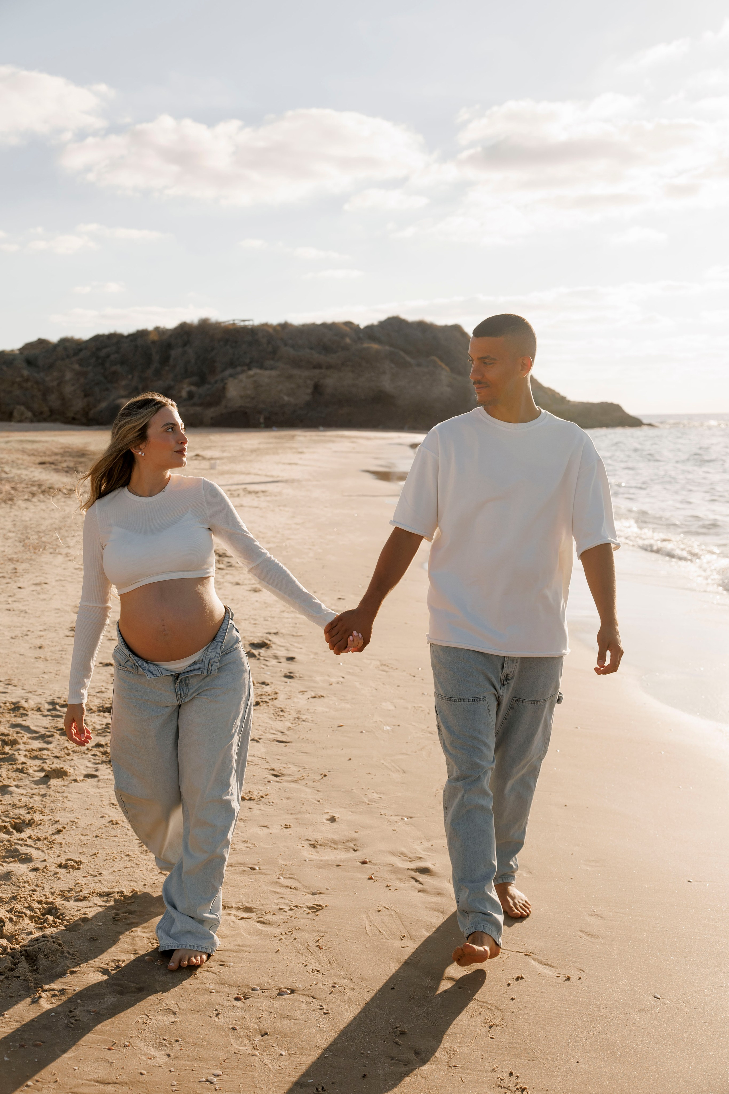 Pregnancy photoshoot near the sea. Wedding and family photographer