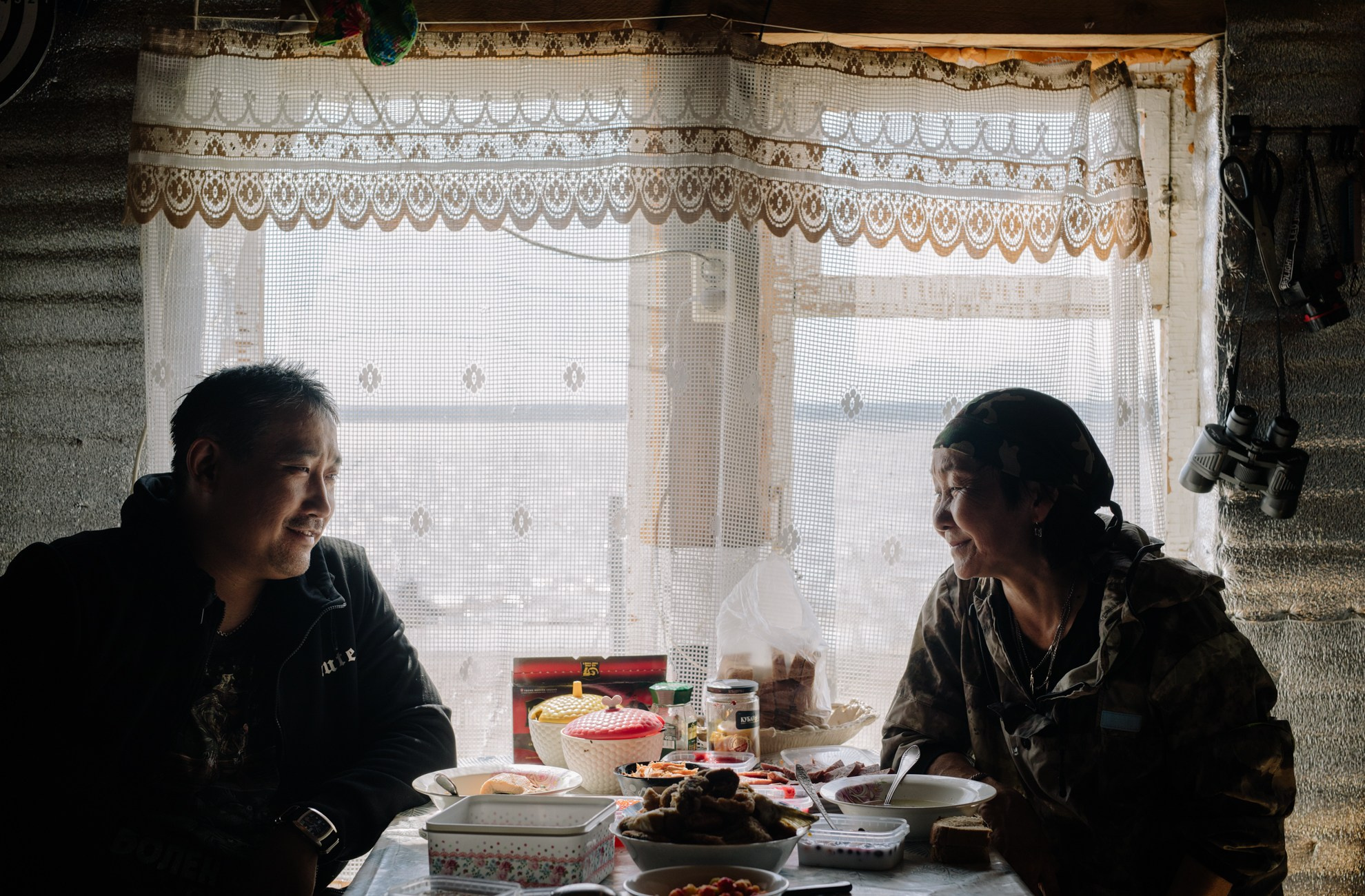 Spouses Andrey Chkhavrun (Nivkh) and Alla Kavozg (Nivkh) are having lunch at home in their ancestral camp in Nyivo, where they are engaged in traditional crafts: hunting and fishing.