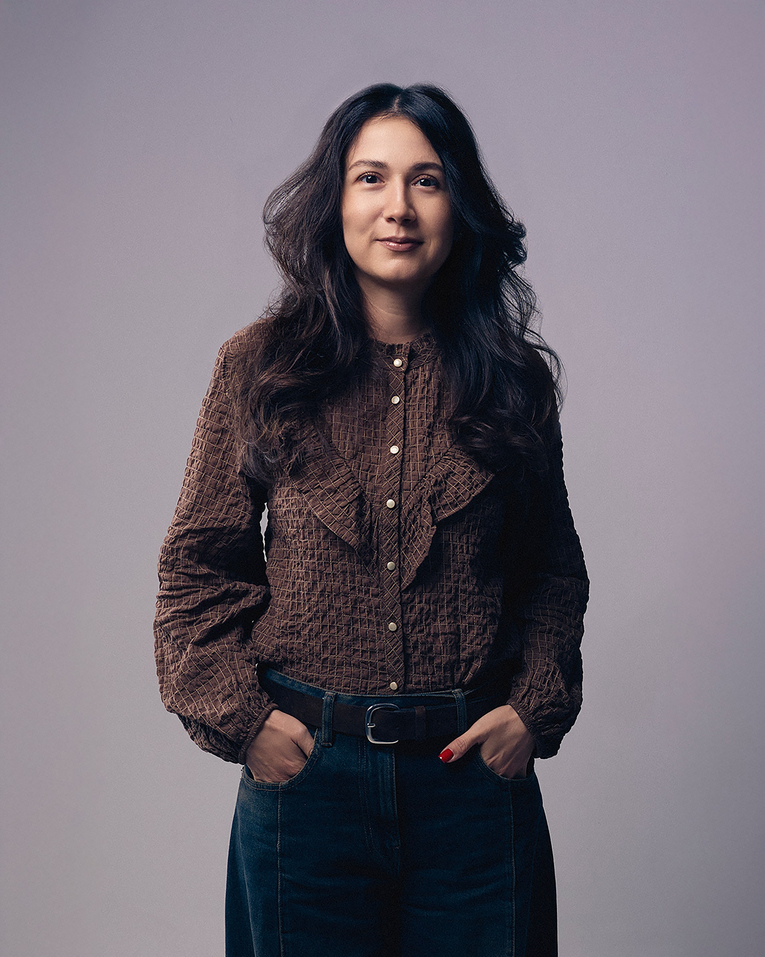 Editorial-style portrait of Pavel Dedishchev in a minimalistic studio