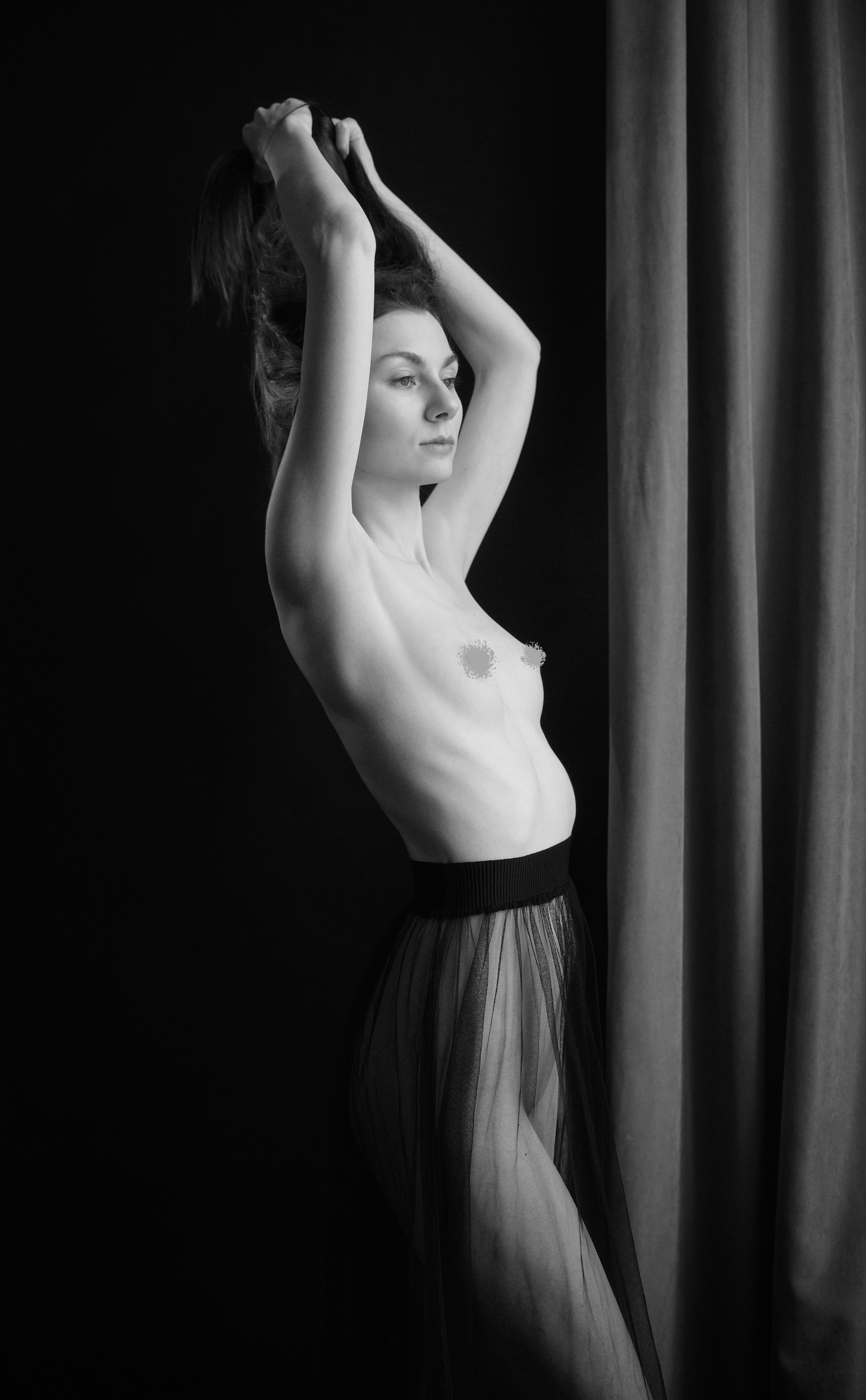 A series of creative photos taken in the studio. The photos are made in the nude genre. Black and white photo