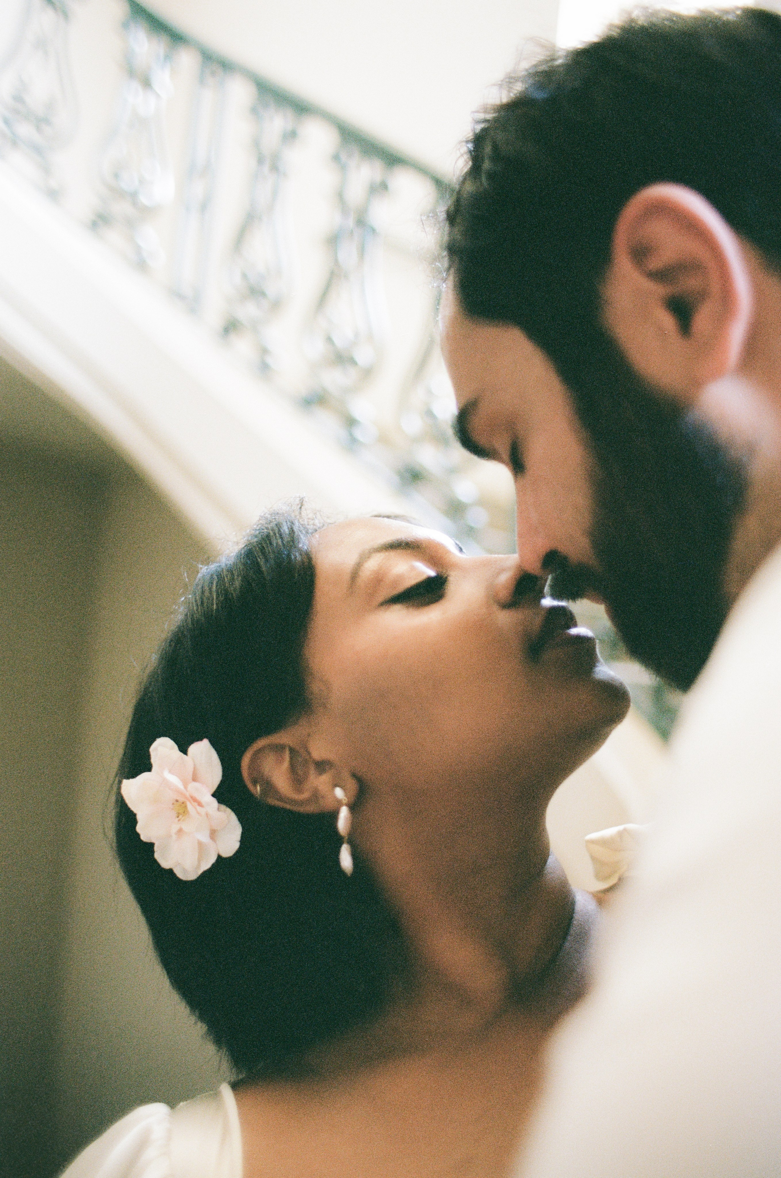 Priscilla inspired photo of a bride and groom on the stairs in city hall
