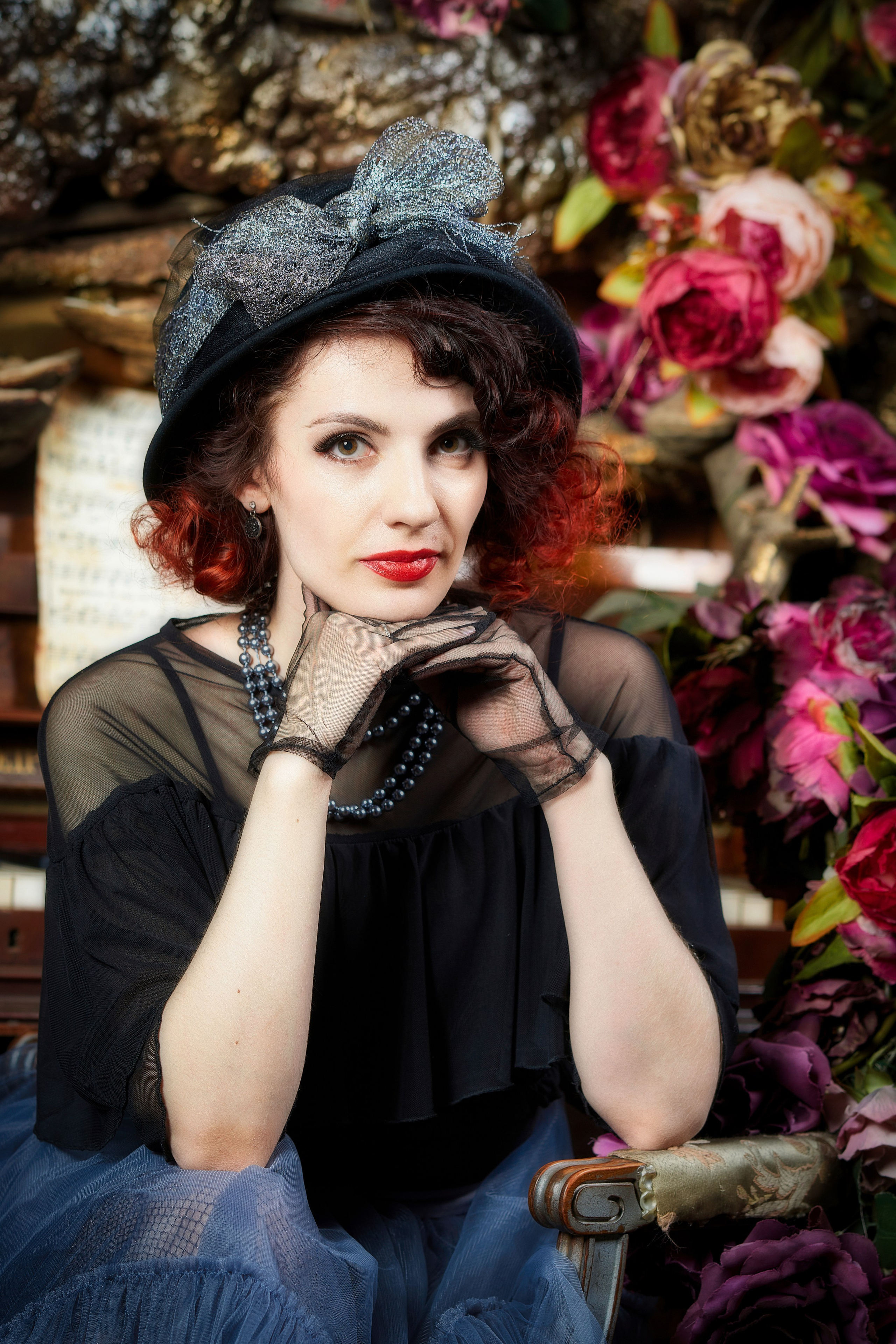 Фотография женщины в шляпке.