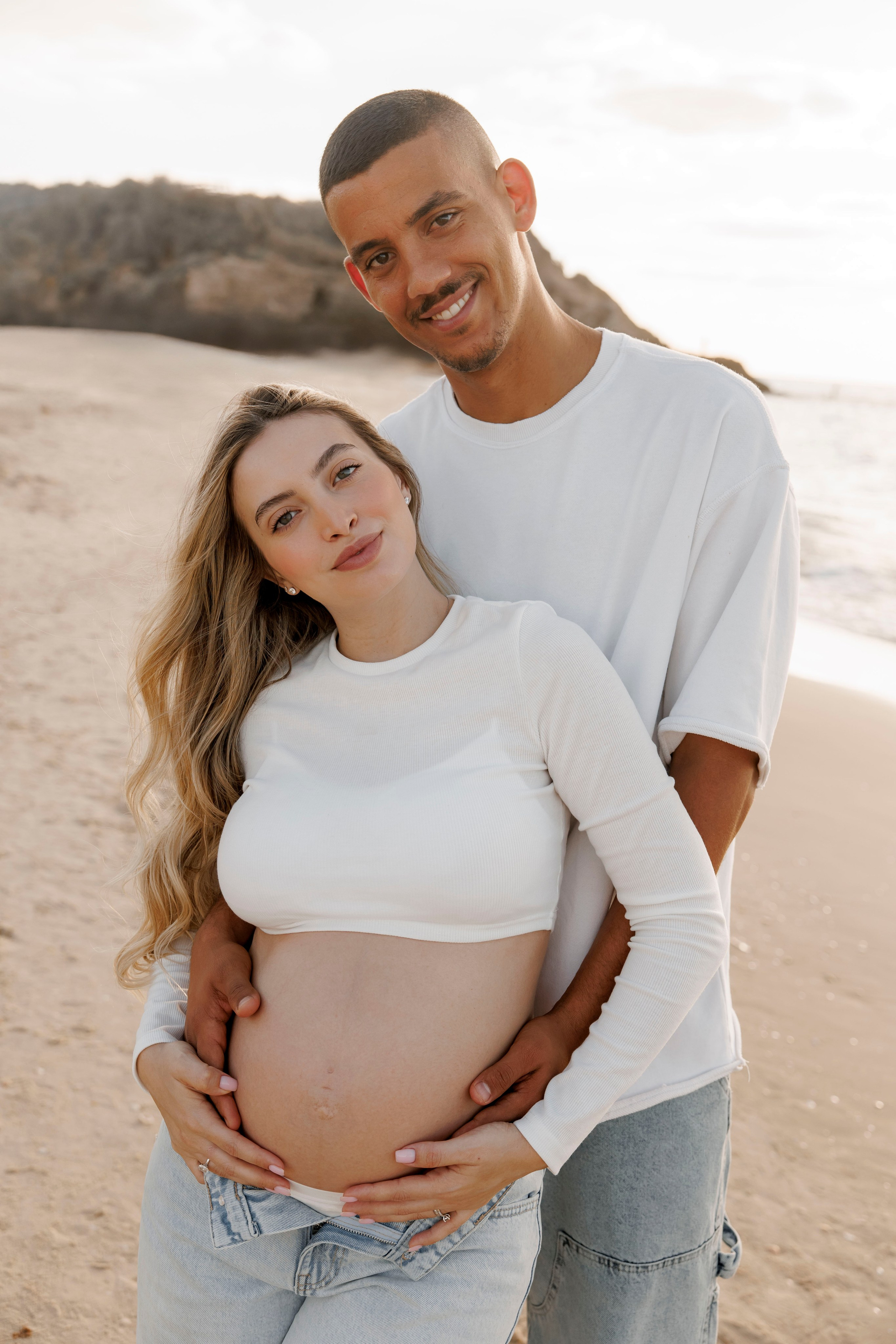 Pregnancy photoshoot near the sea. Wedding and family photographer