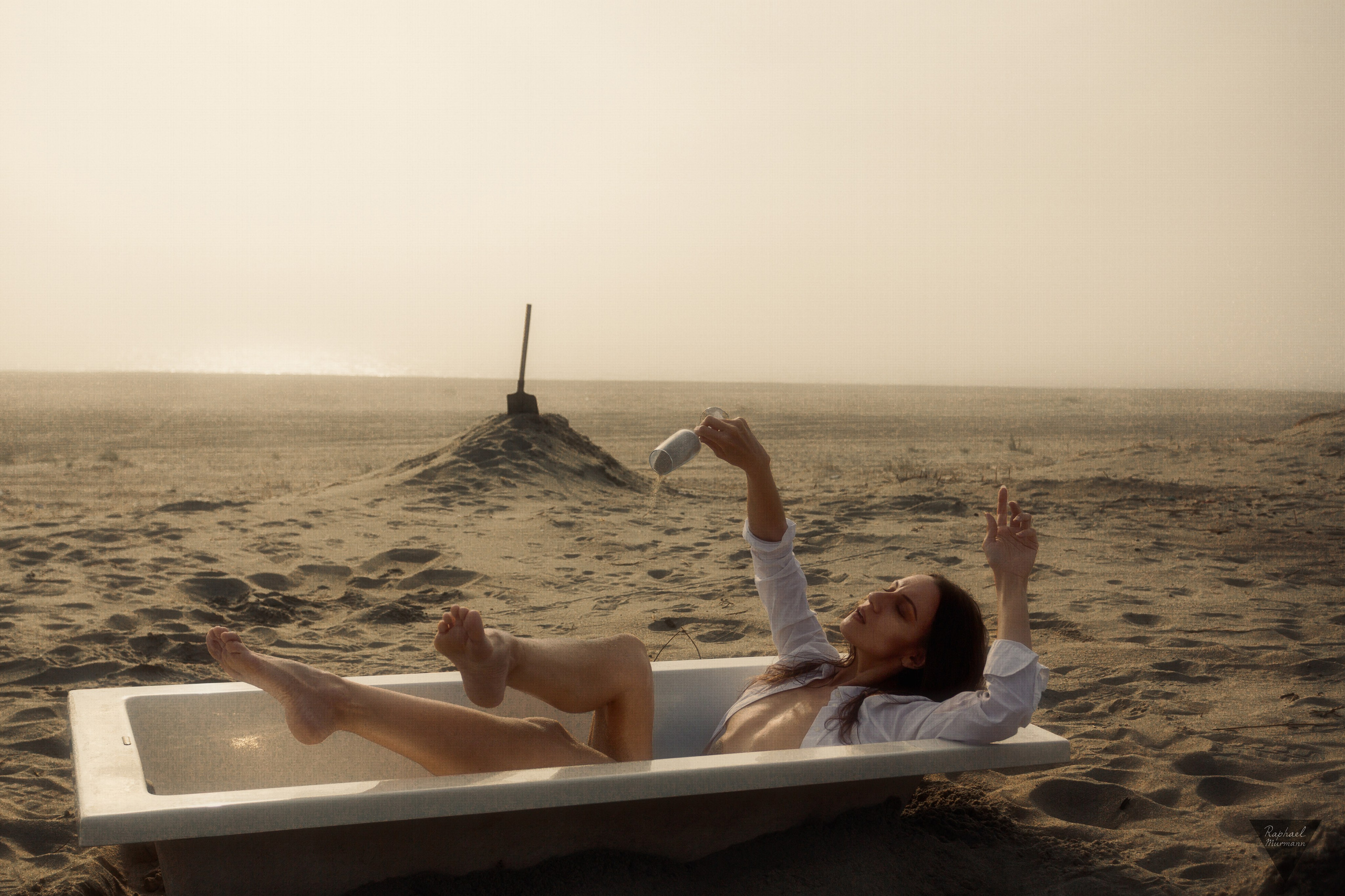 conceptual nude photography sea fog cinematic composition soft colors