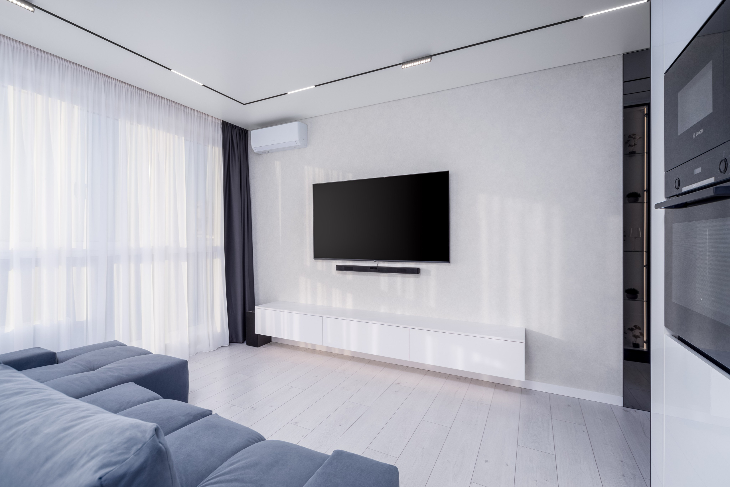 Фото интерьера ТВ зоны в трехкомнатной квартире в комплексе Минск Мир