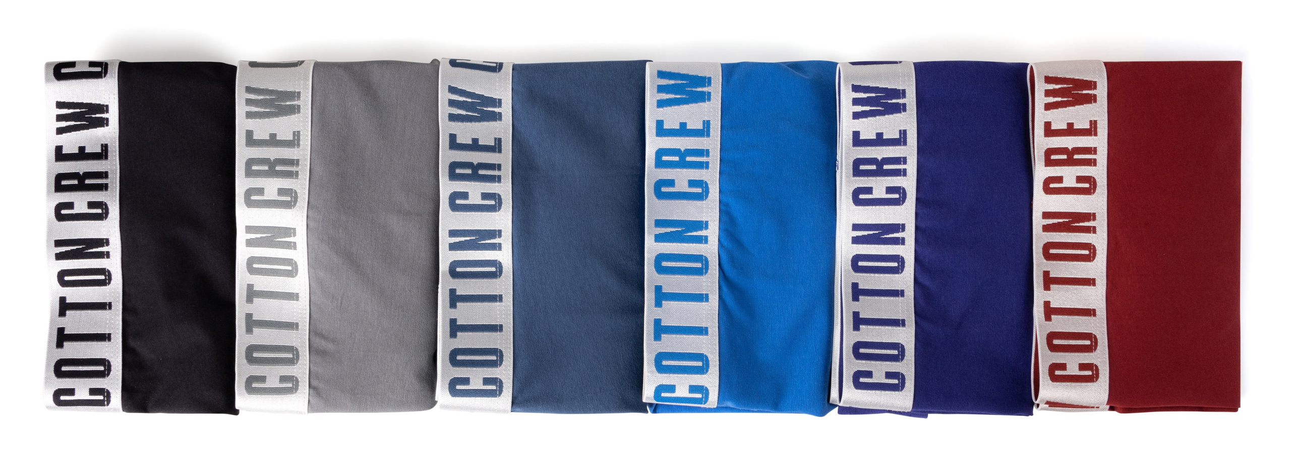 Мужские боксеры разных цветов в раскладке на белом | Съемка для каталога нижнего белья