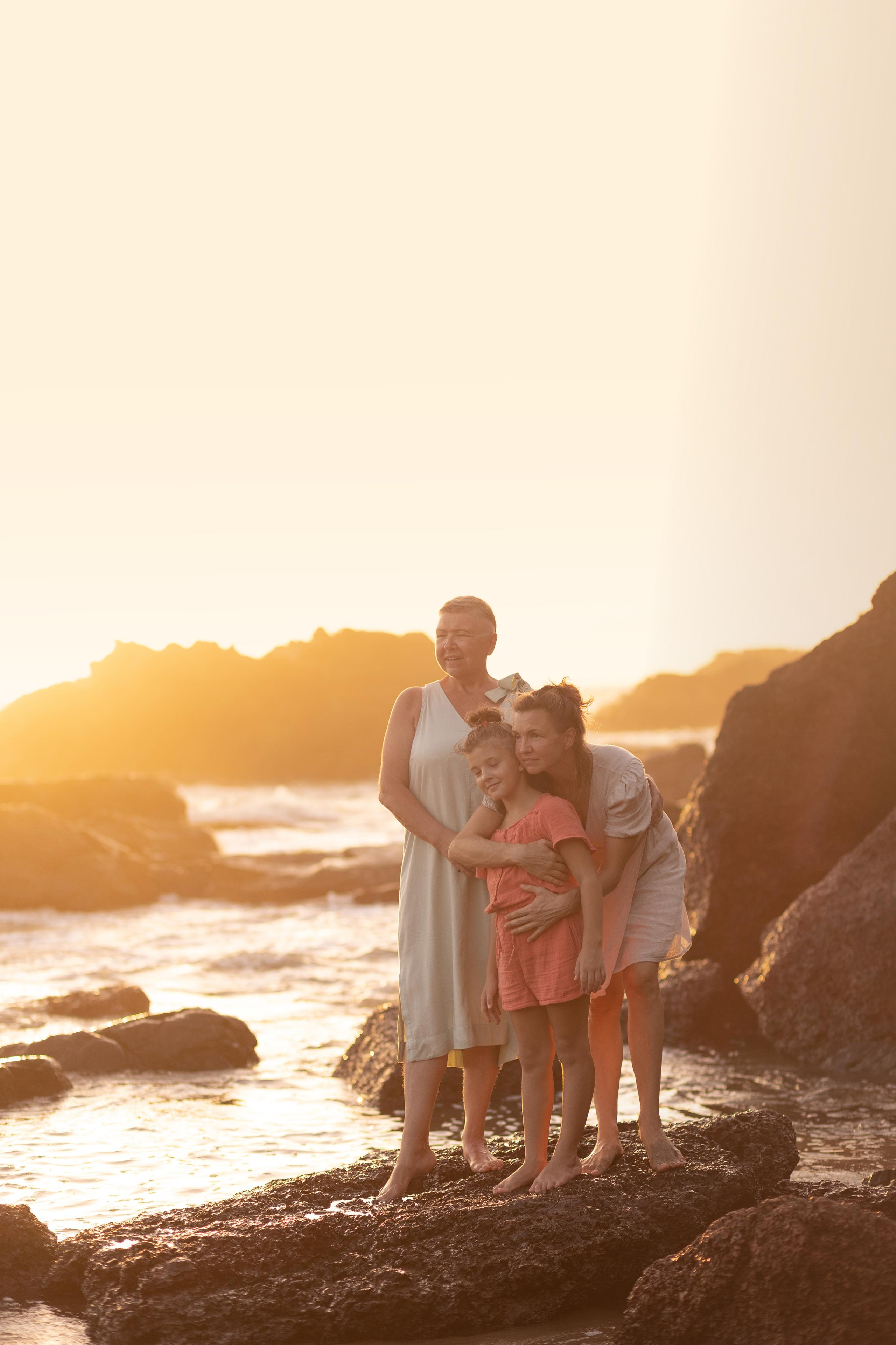 three women looking to the sea on the sweetlake