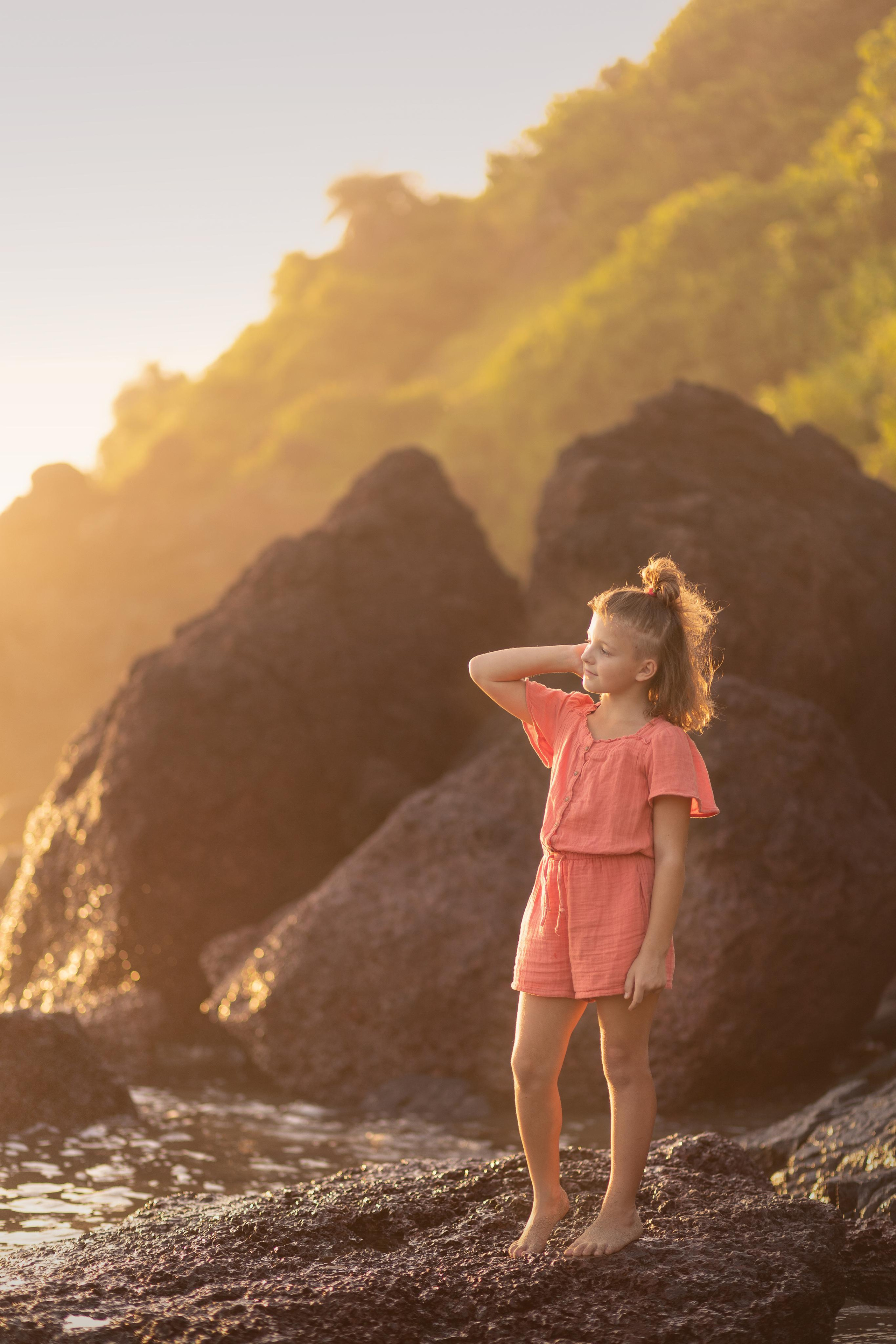 girl standing on the hills in the sea goa