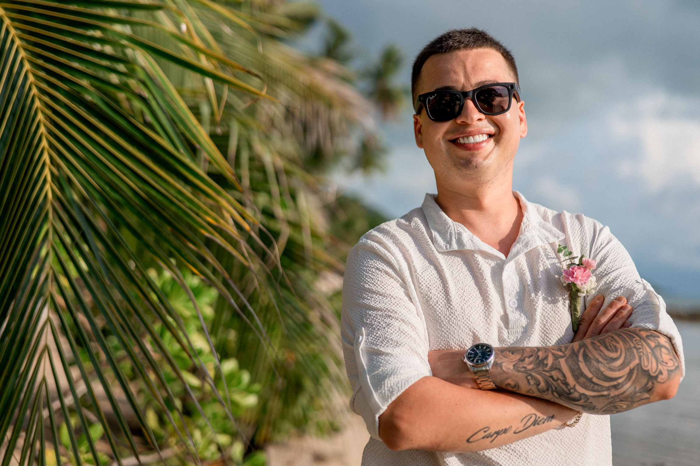 Bride and groom exchanging vows on a private sunset beach
