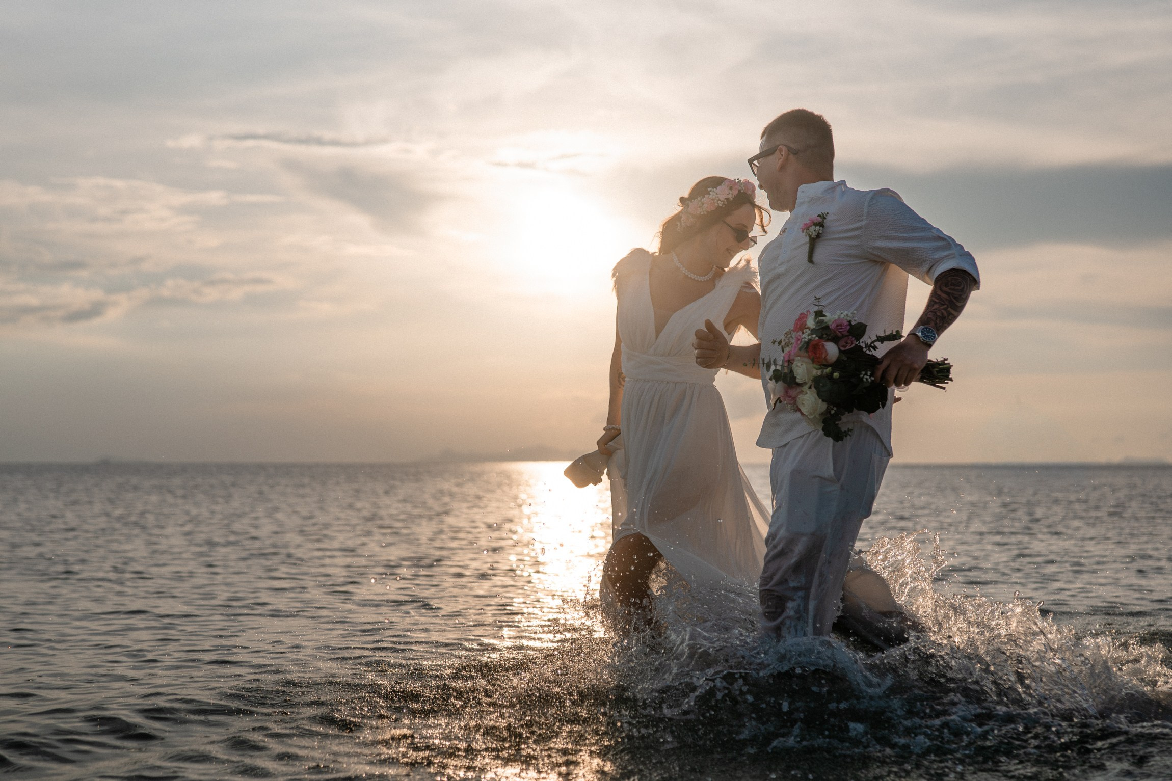Bride and groom during a romantic beach wedding ceremony on Koh Samui, Thailand, surrounded by tropical scenery and ocean views