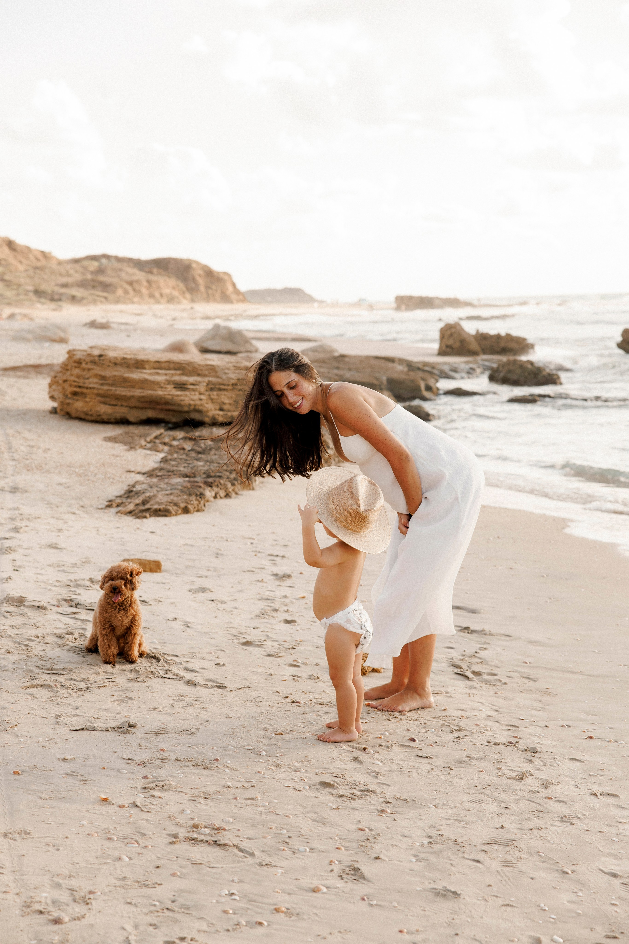 Pregnancy photoshoot near the sea. Wedding and family photographer